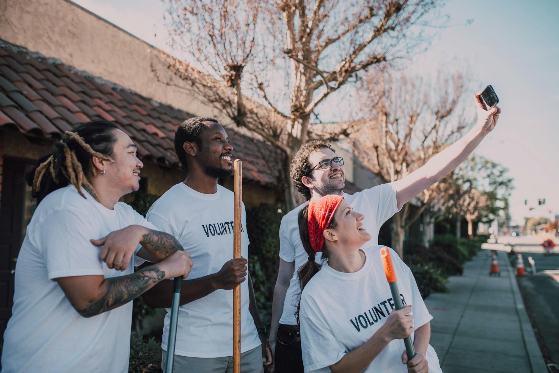 Group of volunteers taking a selfie outdoors