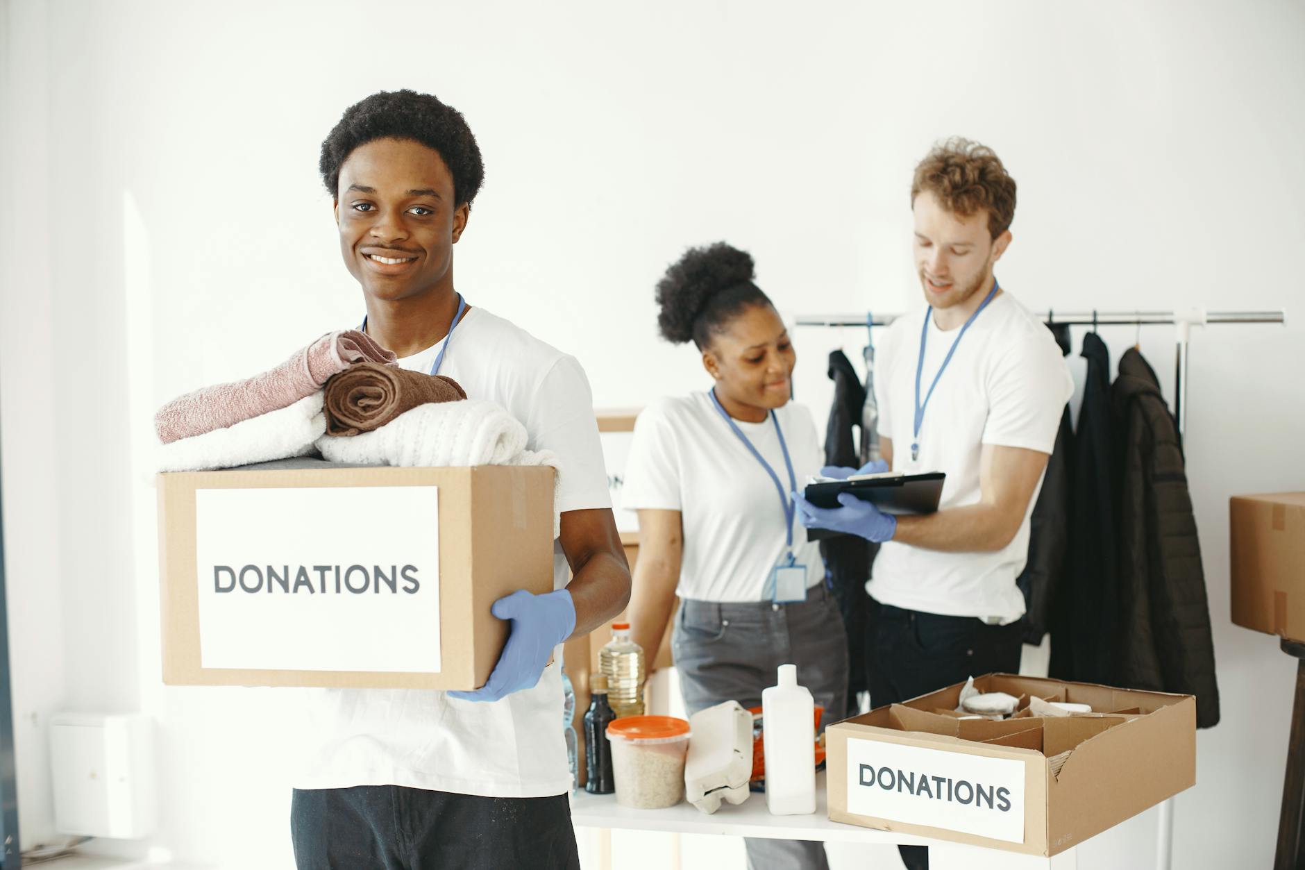 Volunteers organizing donation boxes indoors