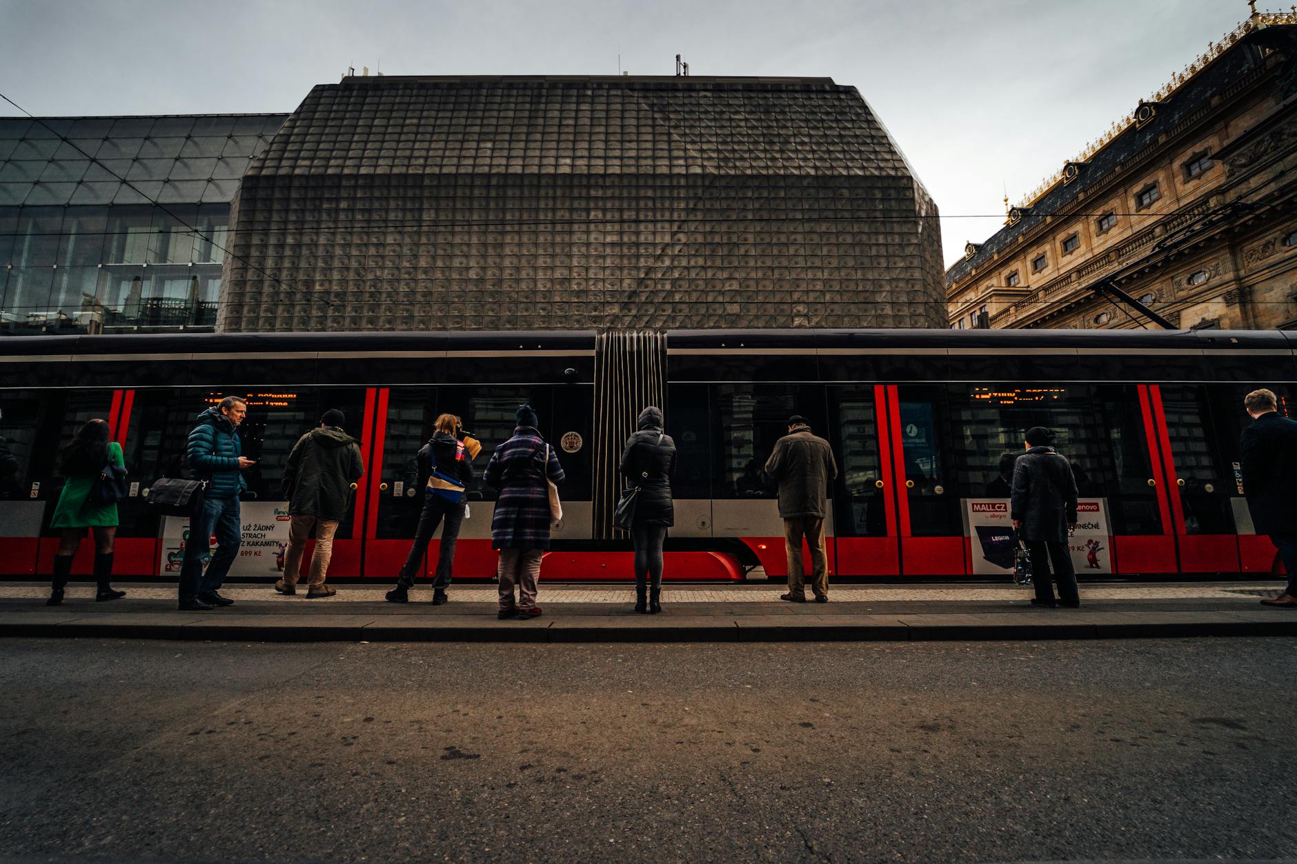 Commuters at a tram stop in Prague
