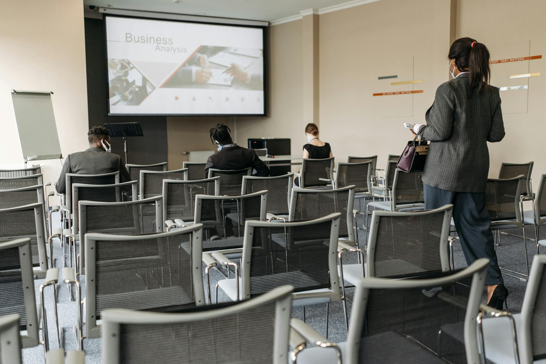 Attendees seated inside a business conference room