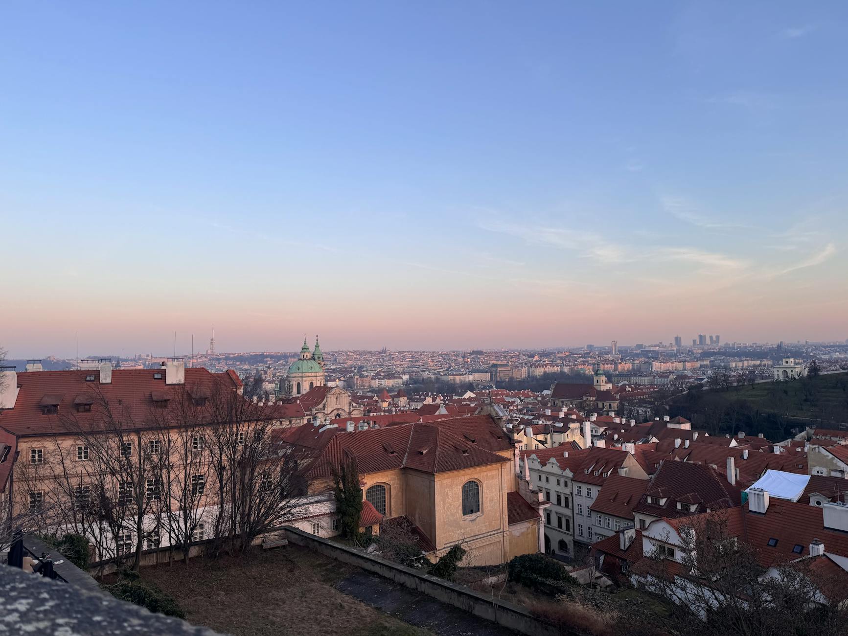 Sunset over Prague rooftops and skyline