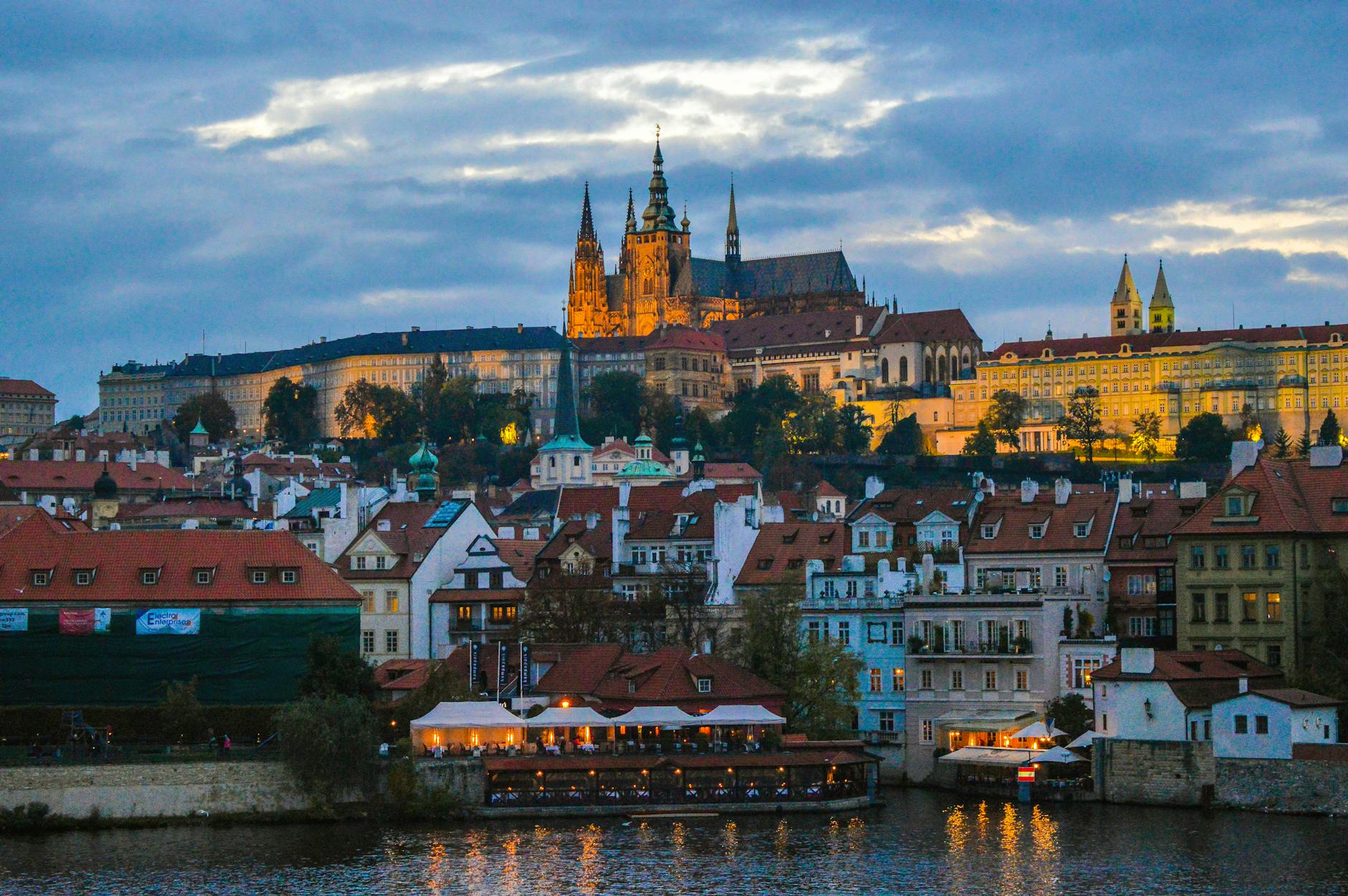 Prague Castle at twilight above the historic cityscape