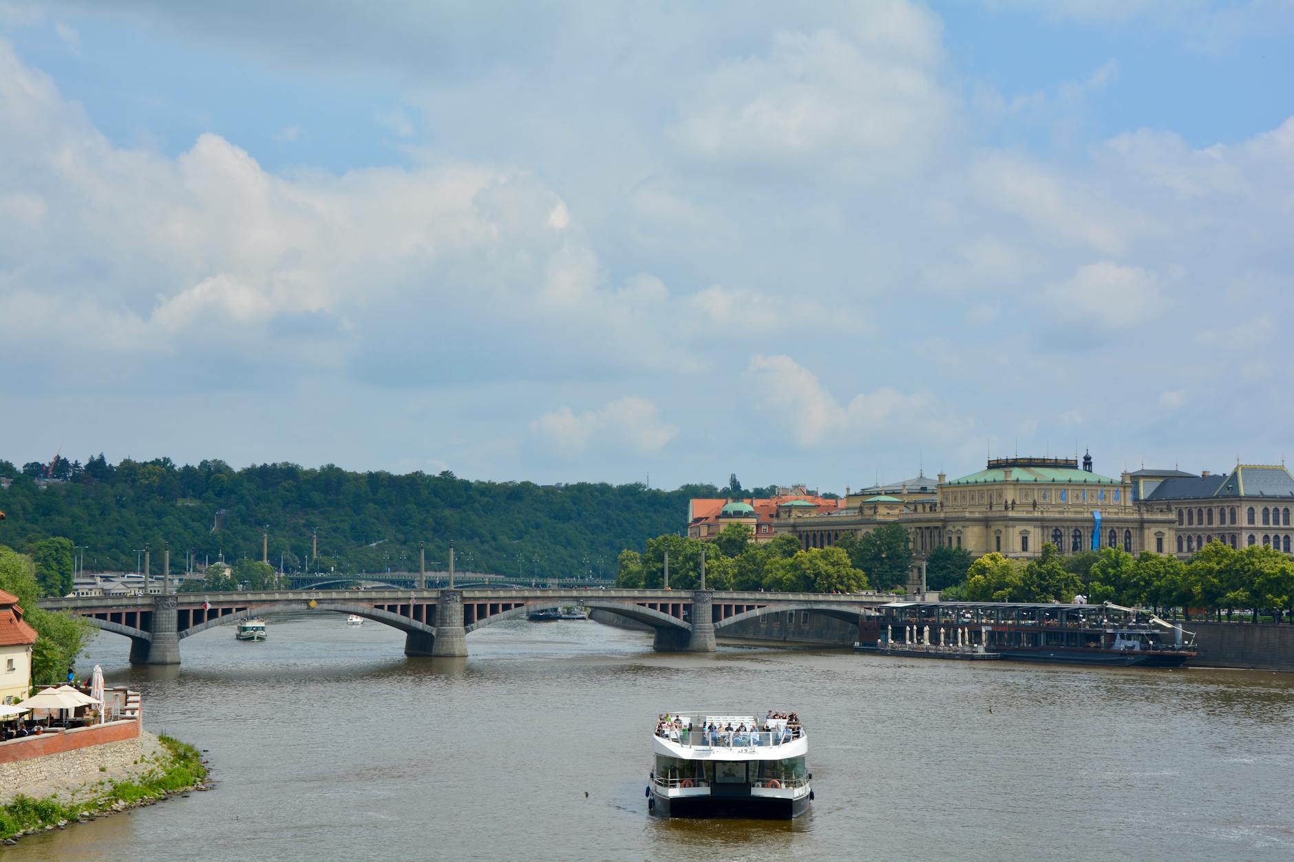 Manes Bridge over the Vltava River with a passenger ship