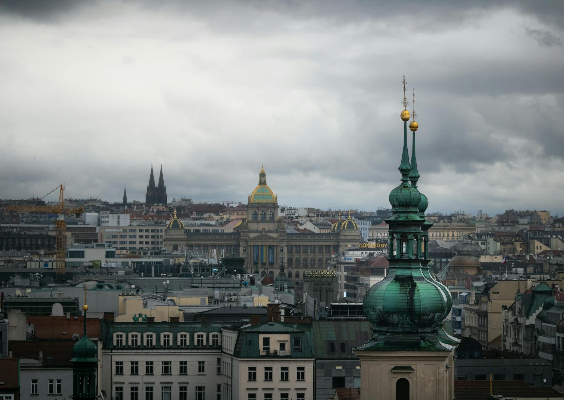 Prague skyline and historic architecture under dramatic skies