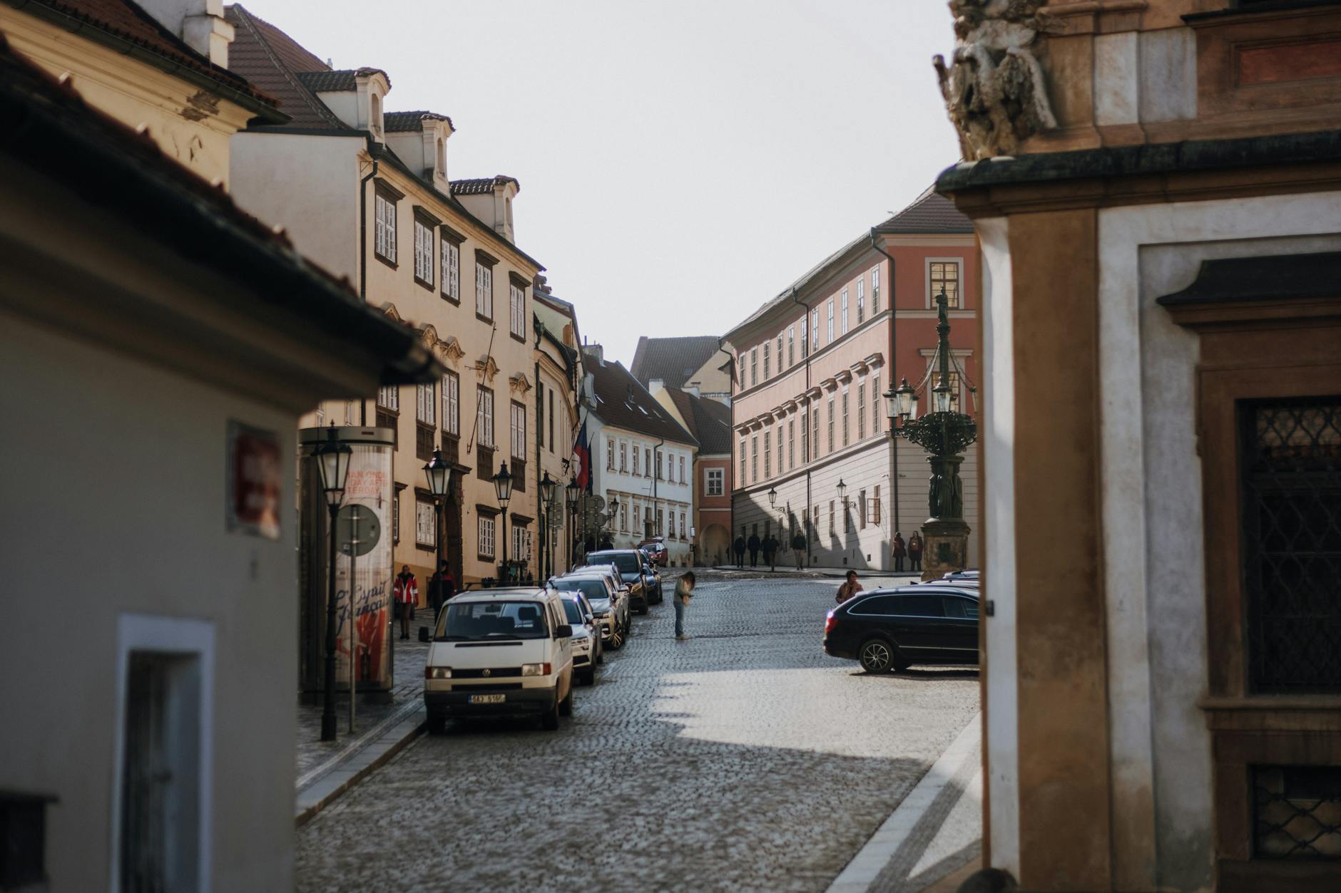 Cobblestone street in Prague lined with historic buildings