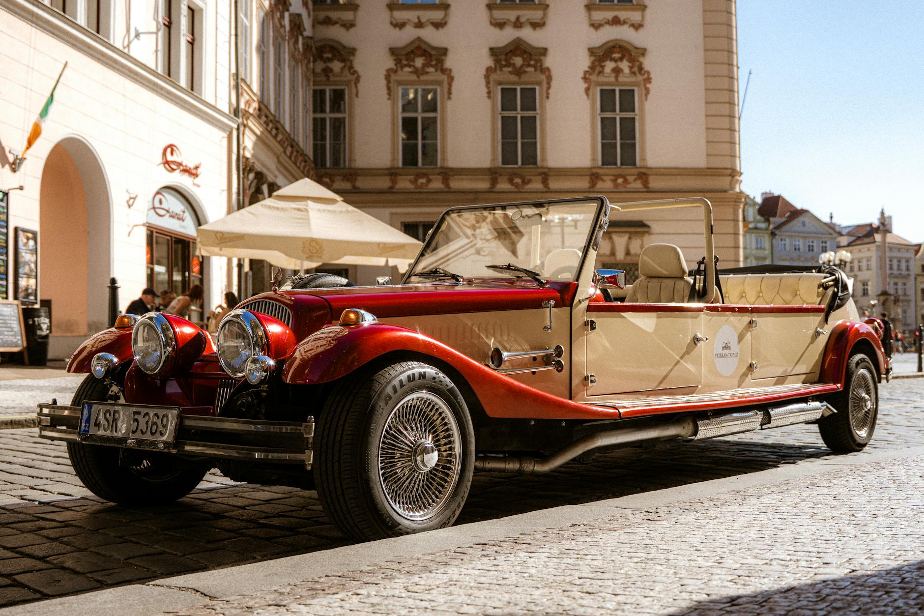 Vintage car parked on a historic Prague street