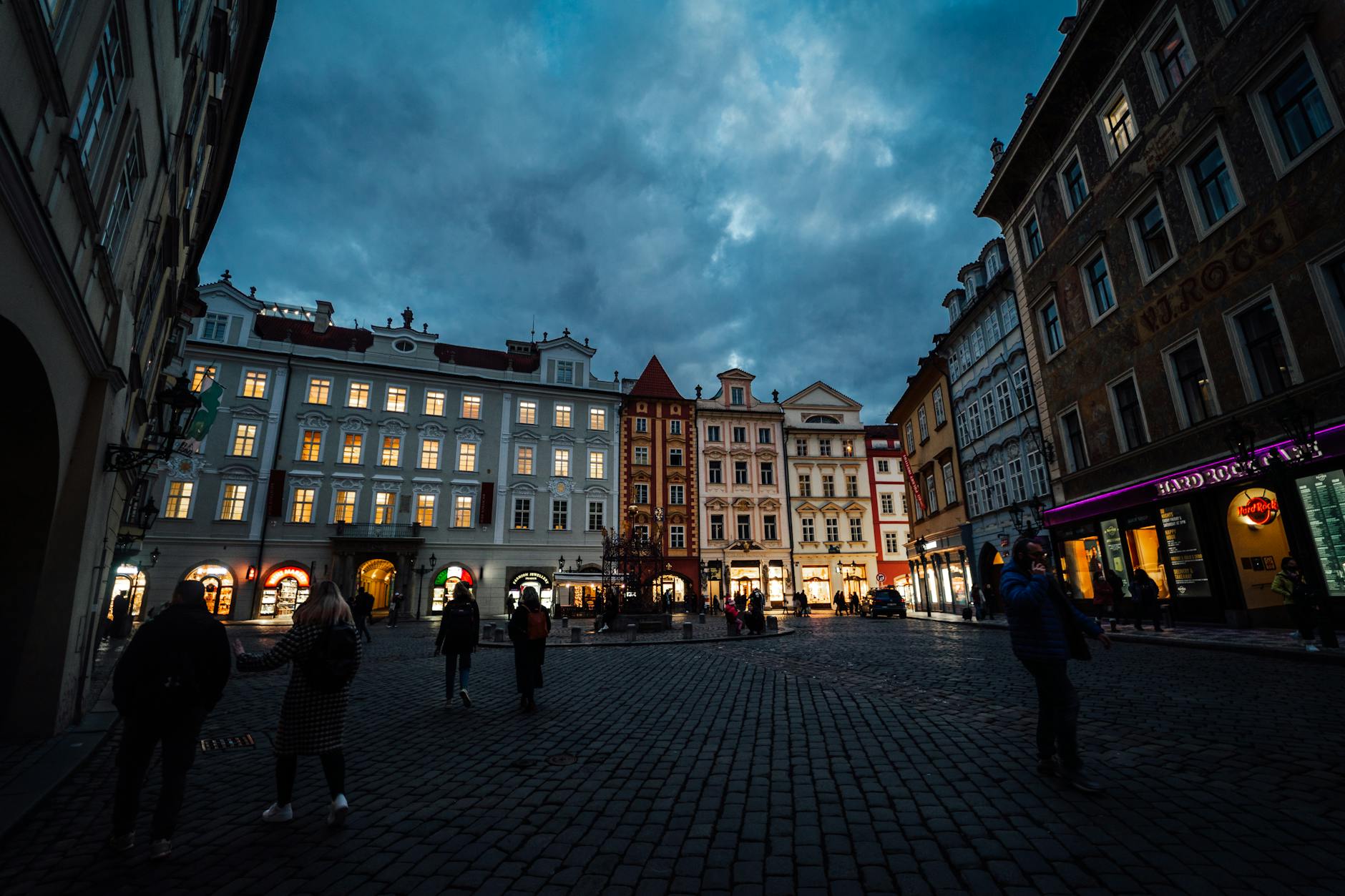 Illuminated historic square in Prague in the evening