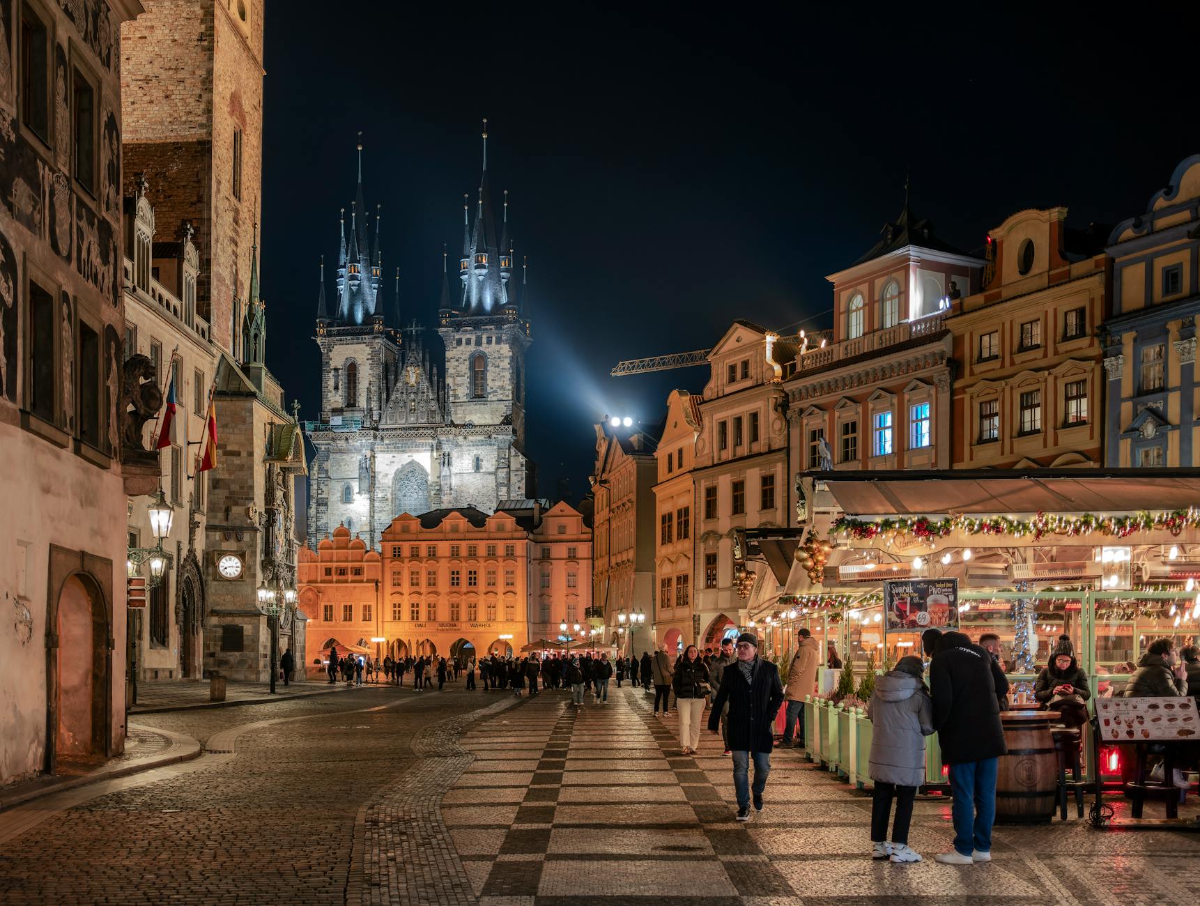 Prague Old Town Square at night with Tyn Church illuminated