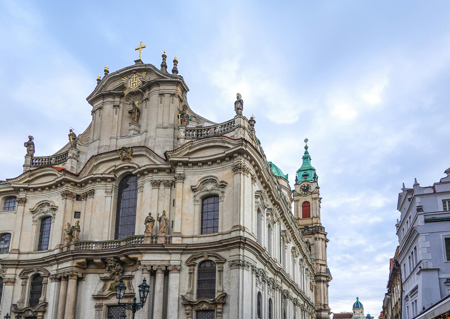 Baroque architecture of St. Nicholas Church in Prague under clear sky