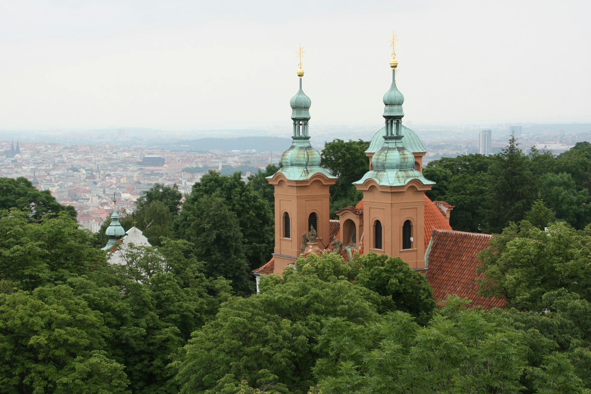 Loreta Church and Prague skyline surrounded by greenery