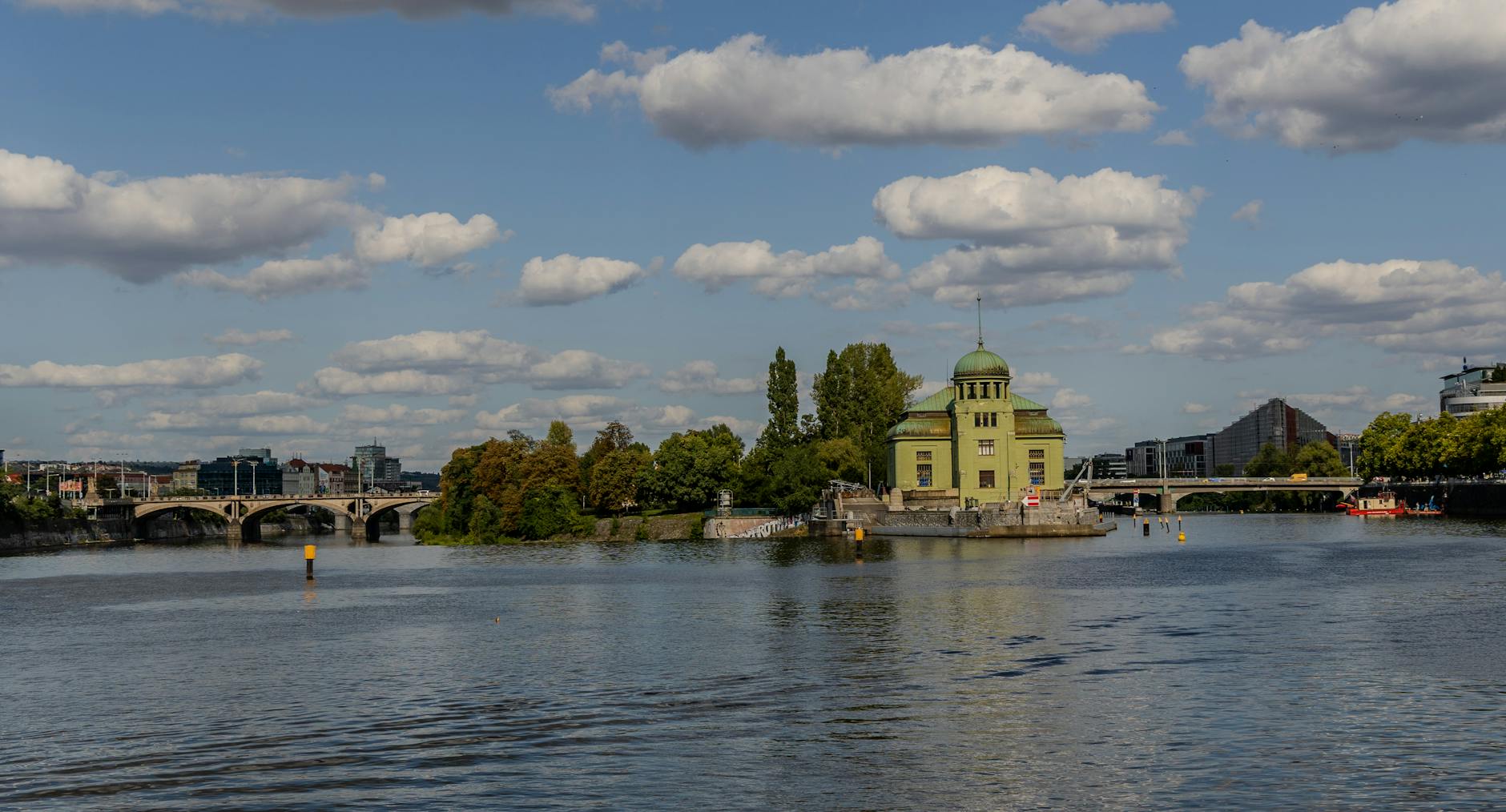 Vltava River and Stvanice Island in Prague under a cloudy sky