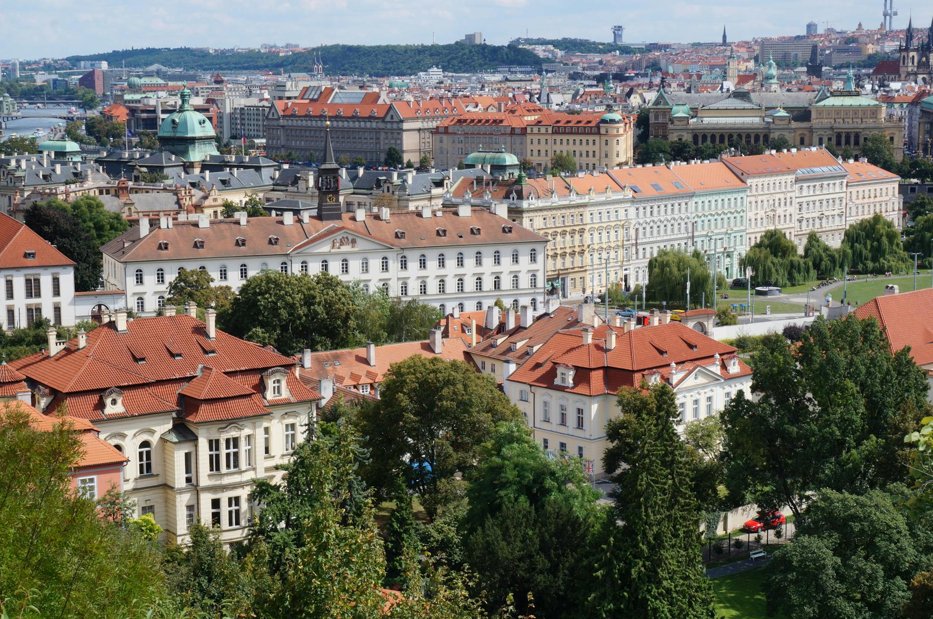 Prague cityscape with historic buildings under bright sky
