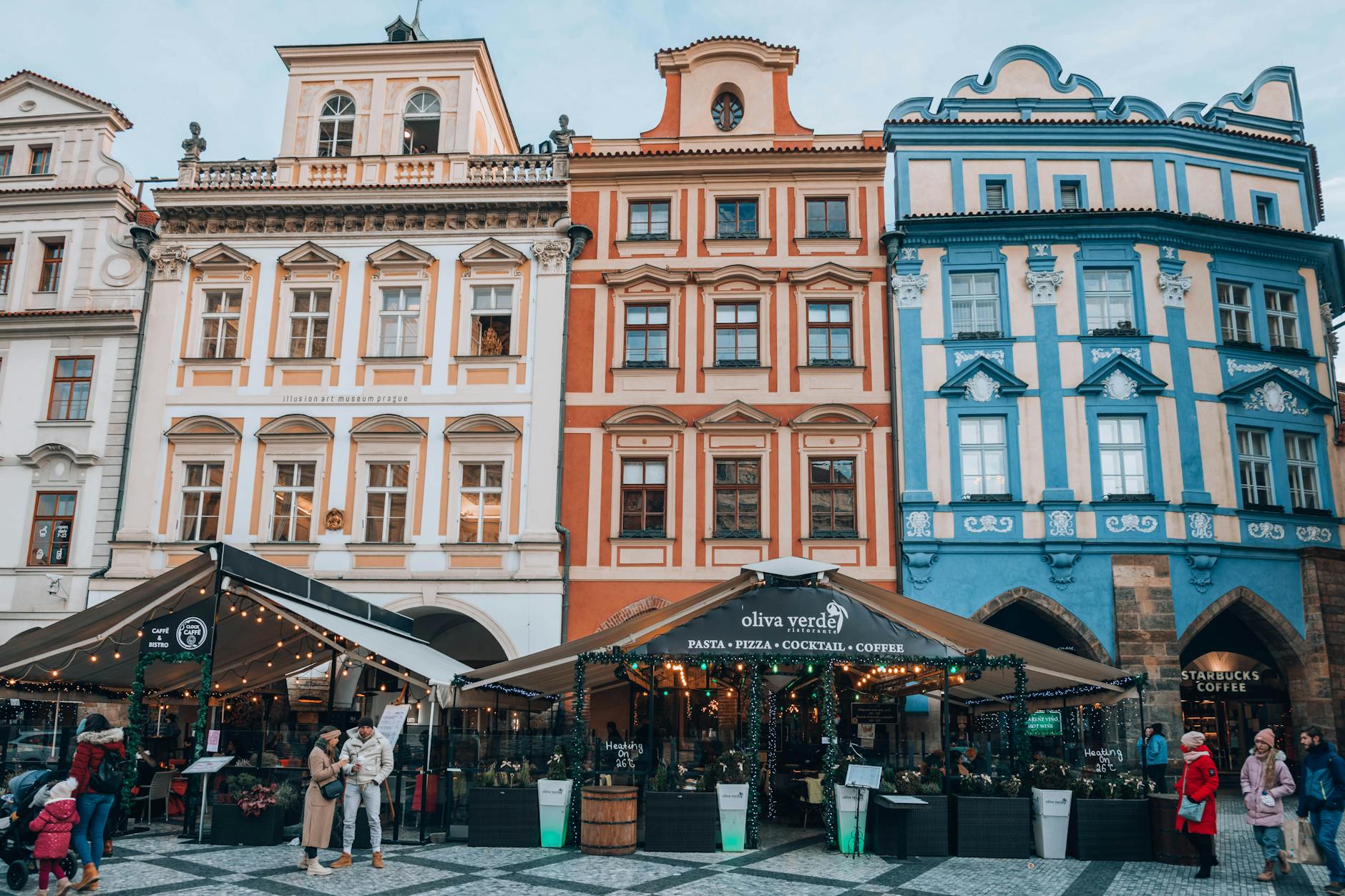 Colorful Prague street with lively cafes