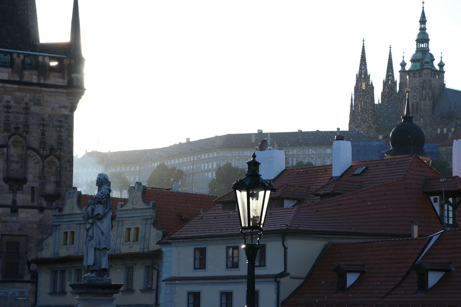 Prague rooftops and Gothic architecture at dusk