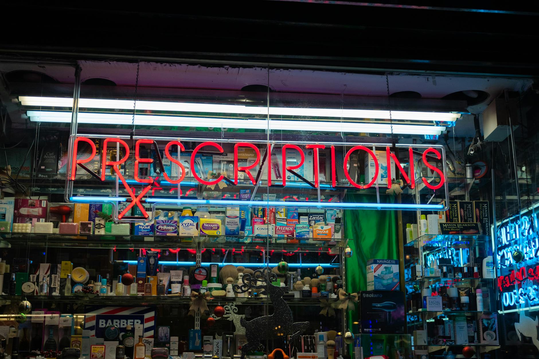 Illuminated pharmacy sign at night