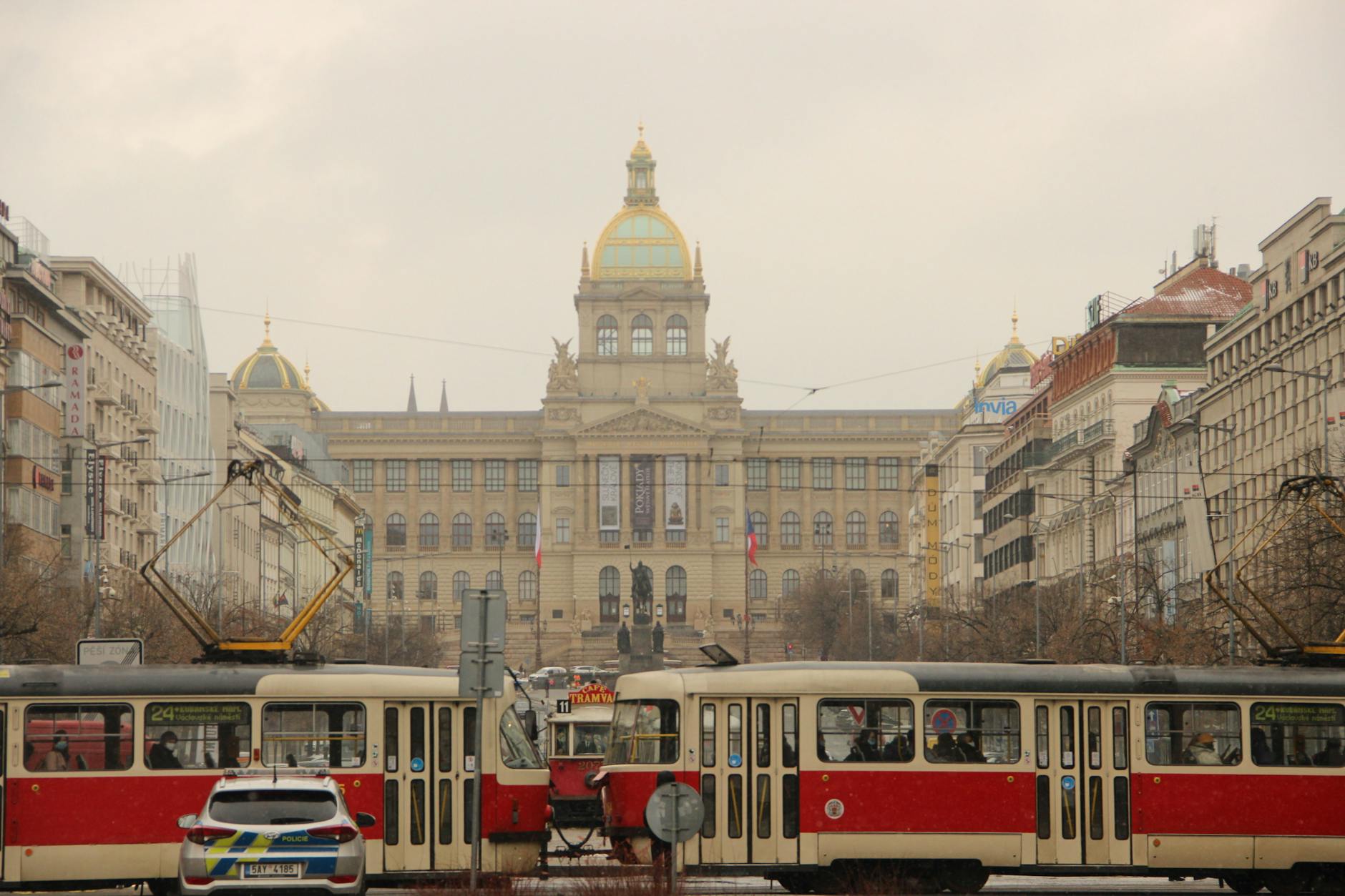 Prague trams and National Museum in an urban street view