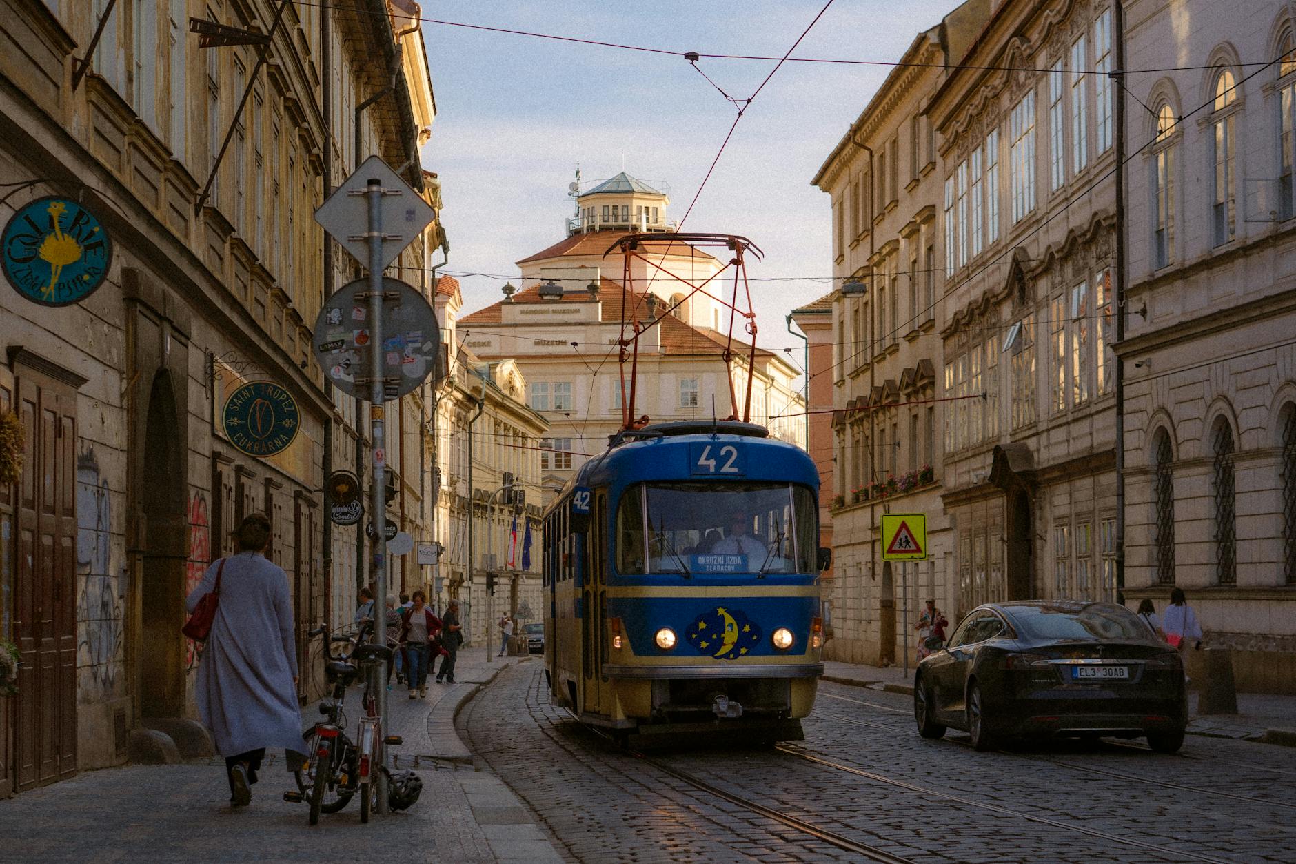 Tram on a cobblestone street in historic Prague