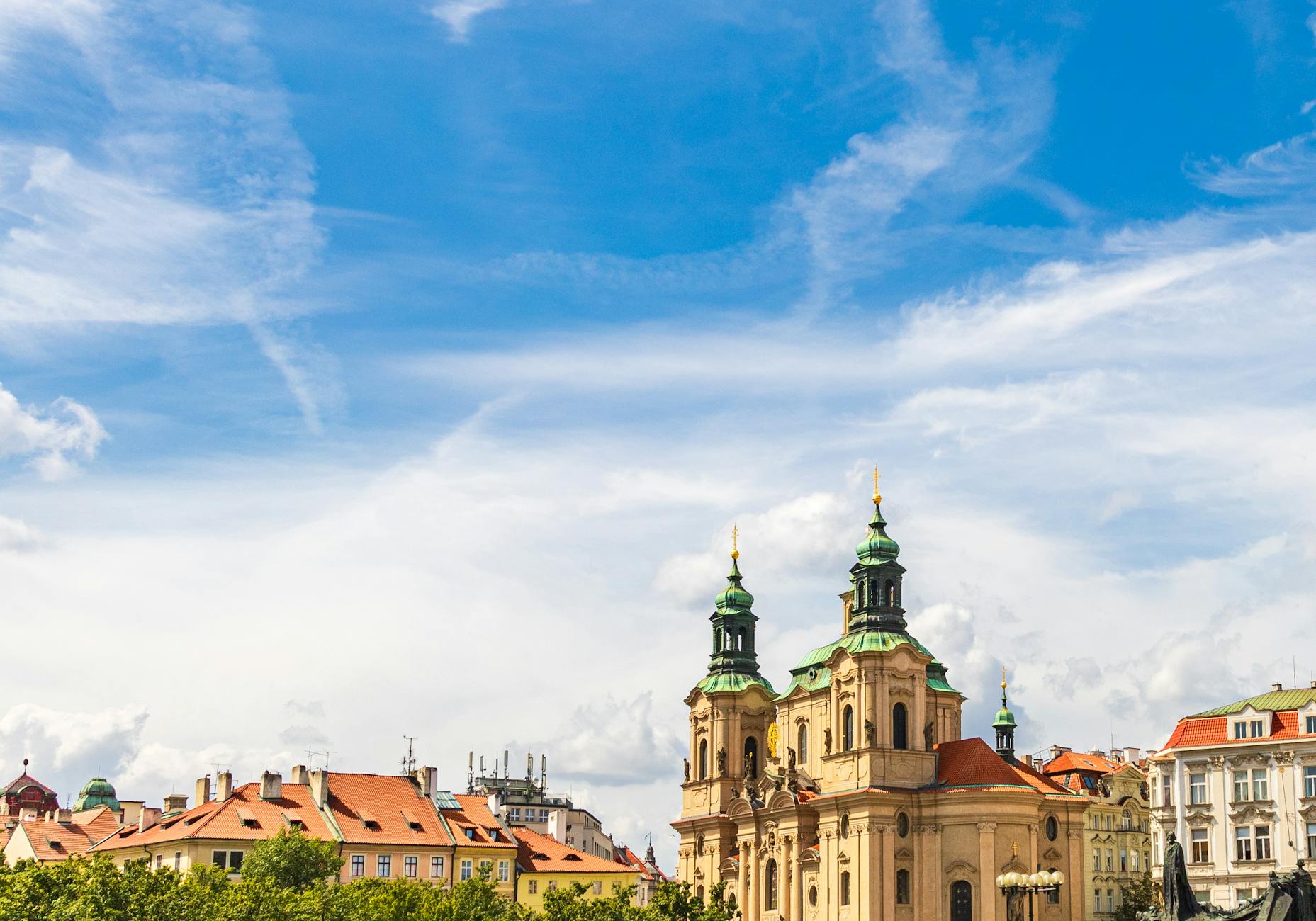 Saint Nicholas church exterior in Prague under a blue sky