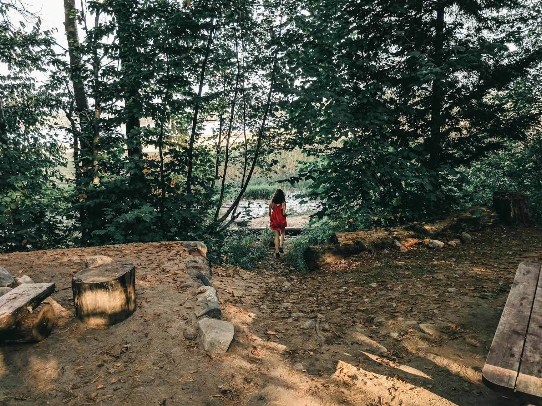 Woman walking through a forest trail in Quebec City