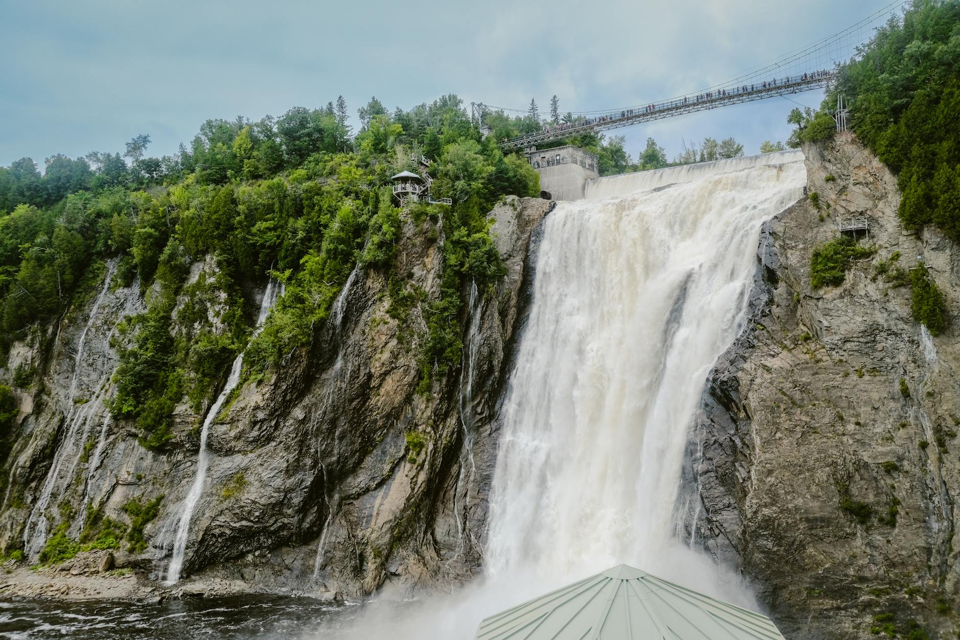 Montmorency Falls with greenery and a suspension bridge