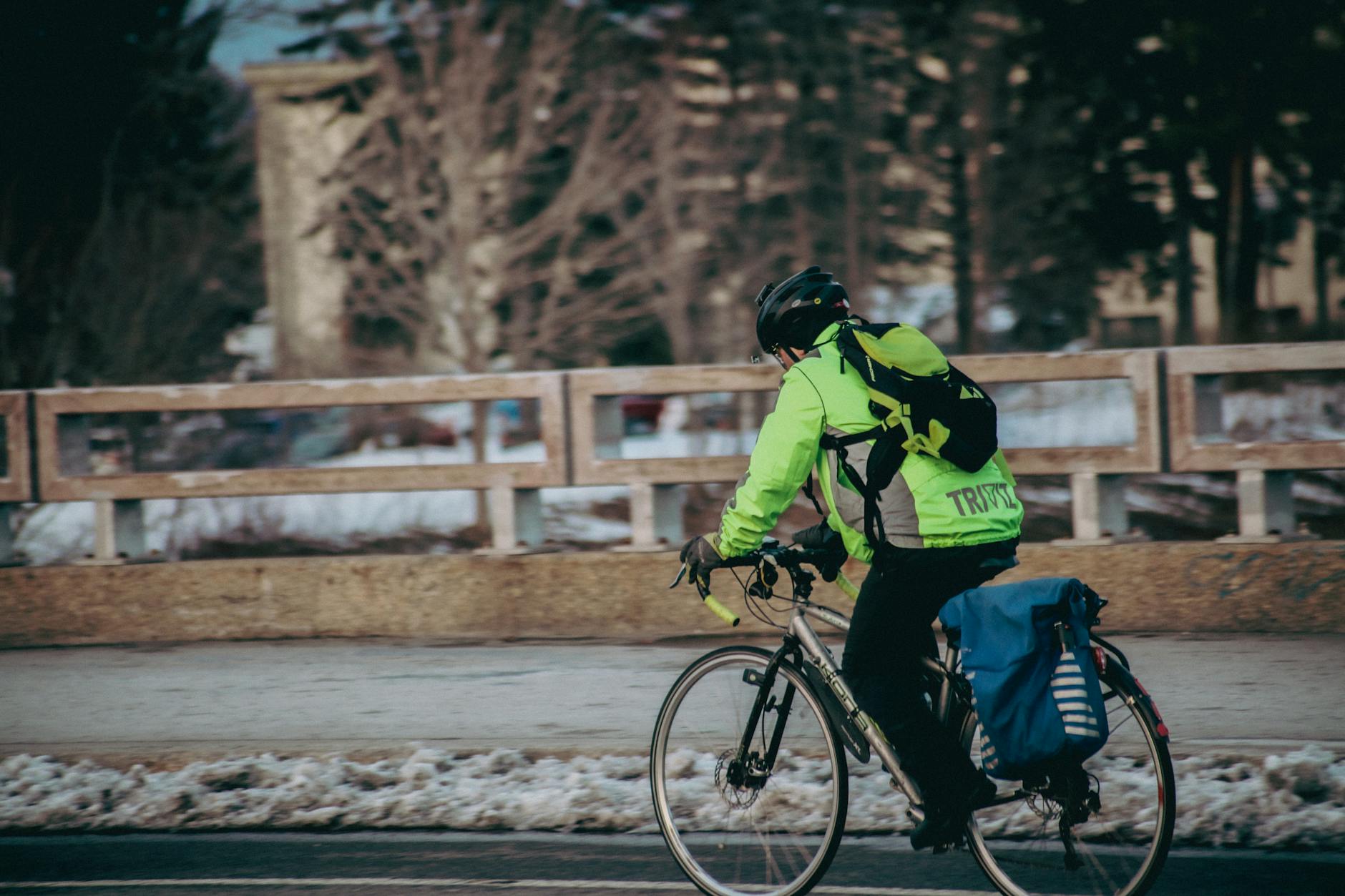 Cyclist riding through Quebec streets in winter