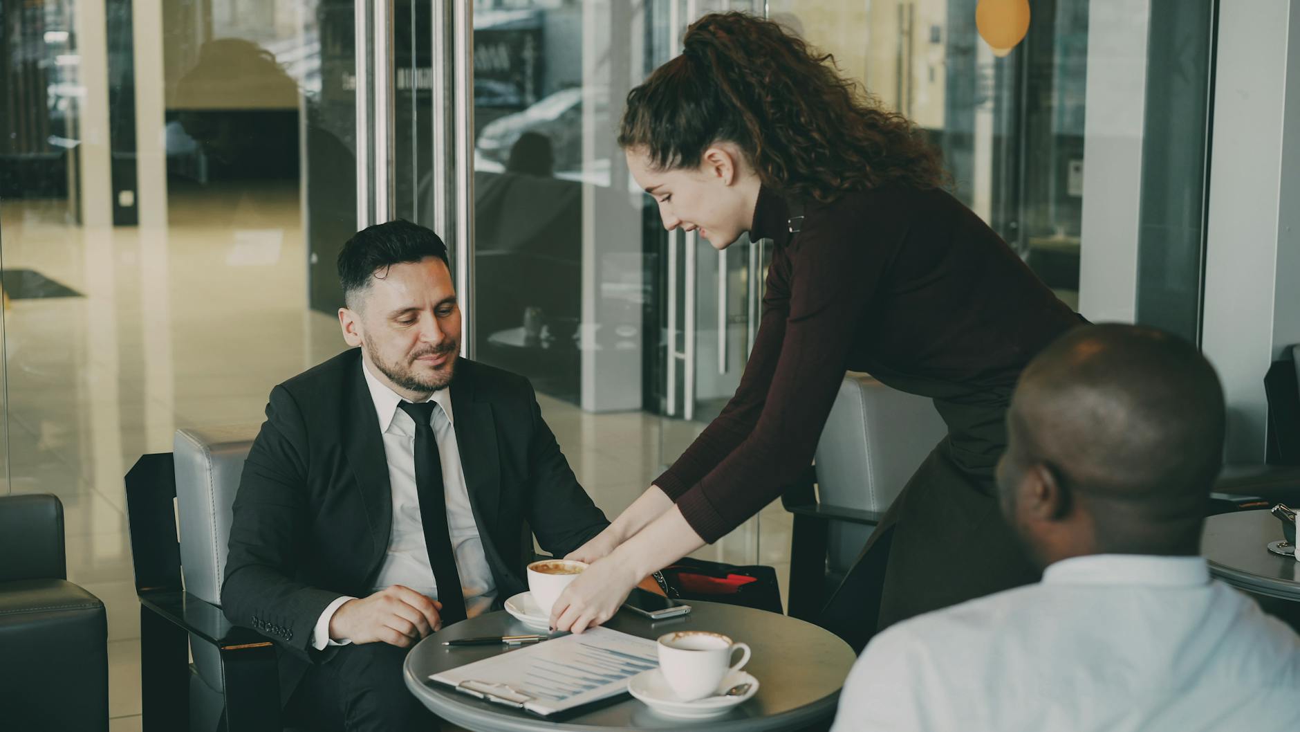 Business meeting in a cafe with coffee service