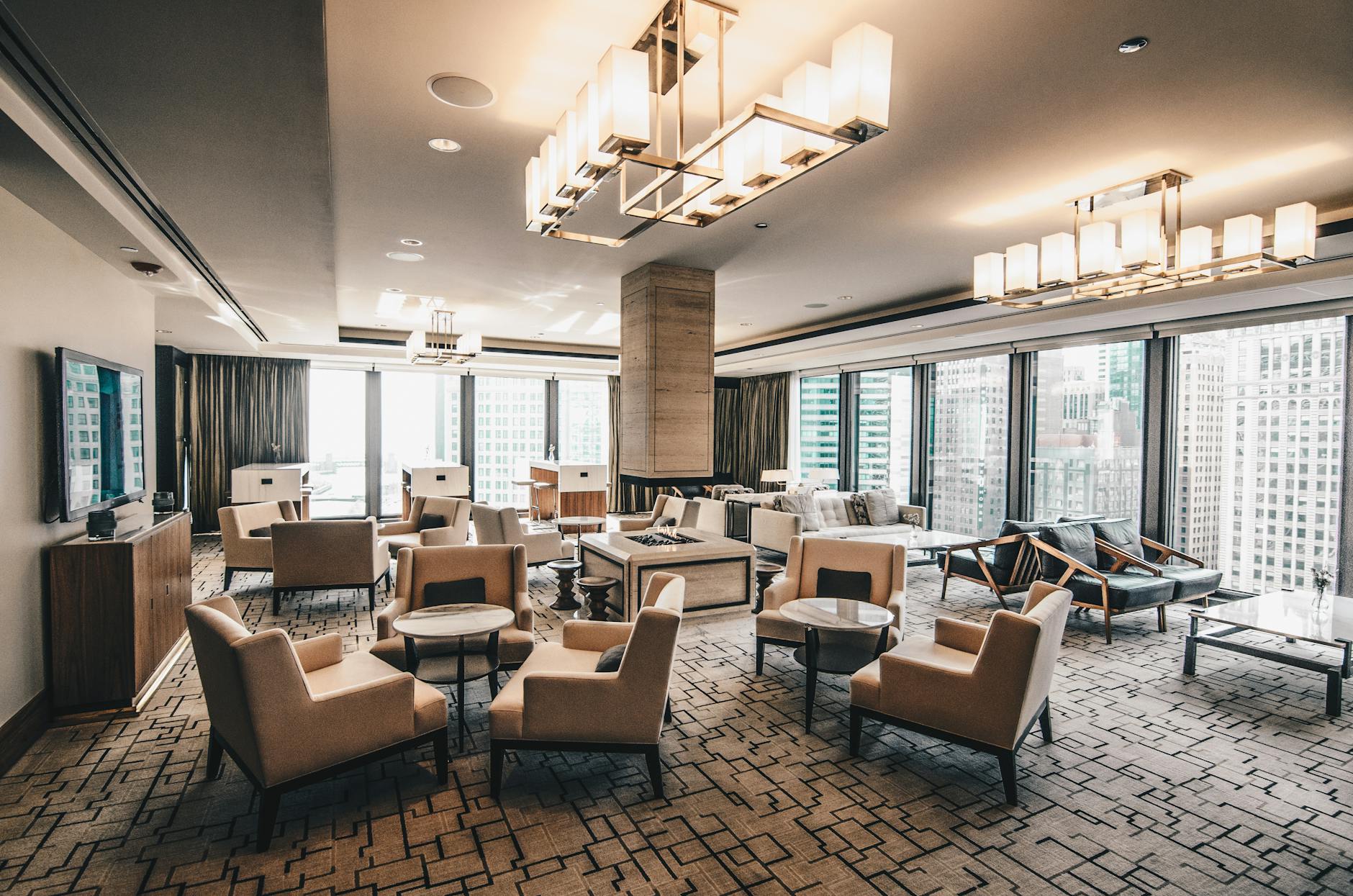 Modern hotel lounge with city views and stylish furniture