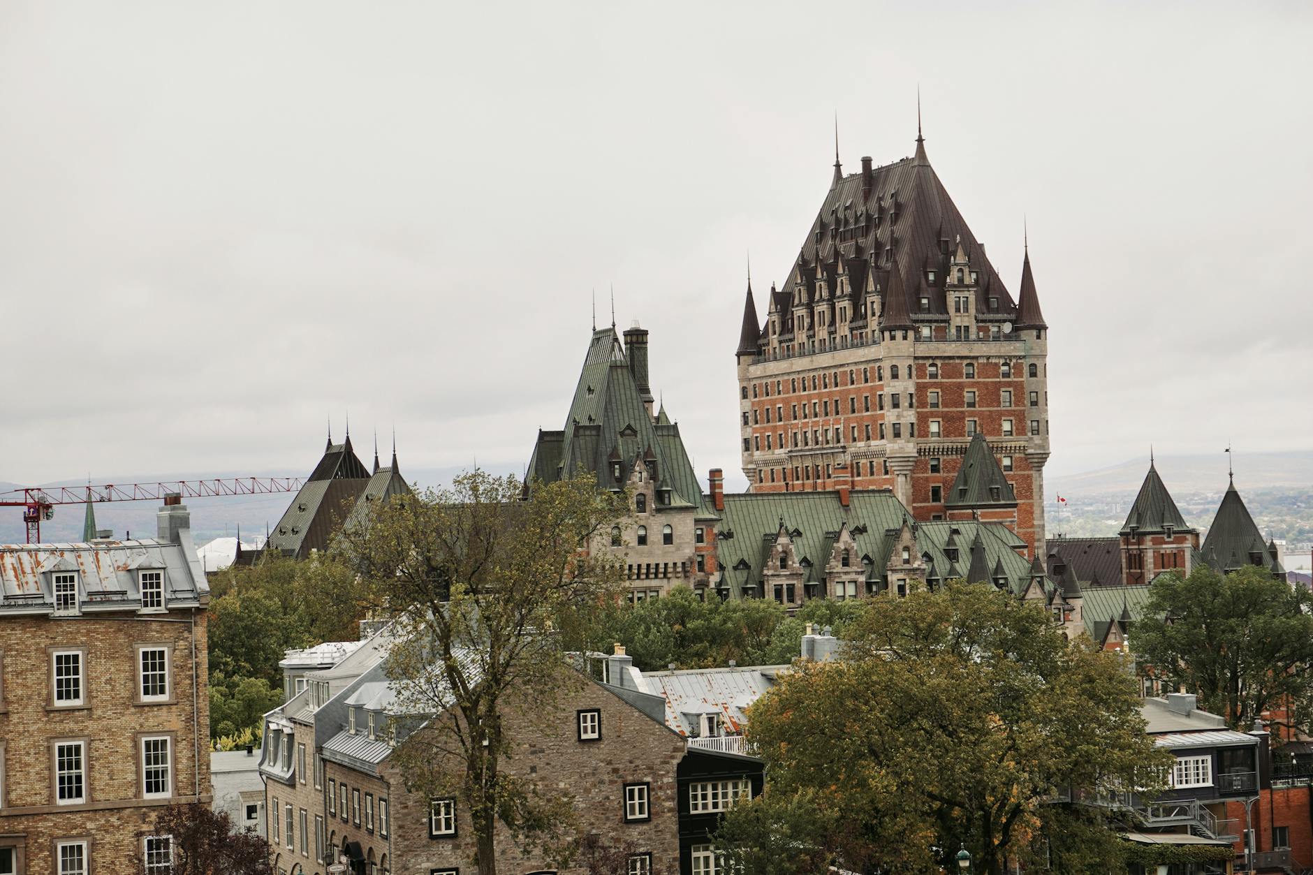 Chateau Frontenac and historic Quebec City architecture under a cloudy sky