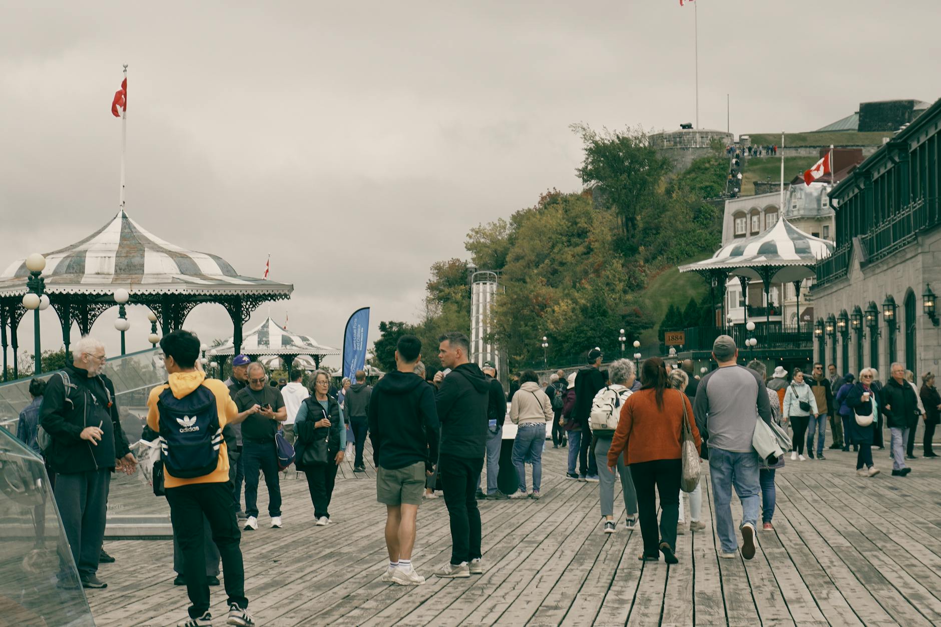 People walking on a historic Quebec City boardwalk