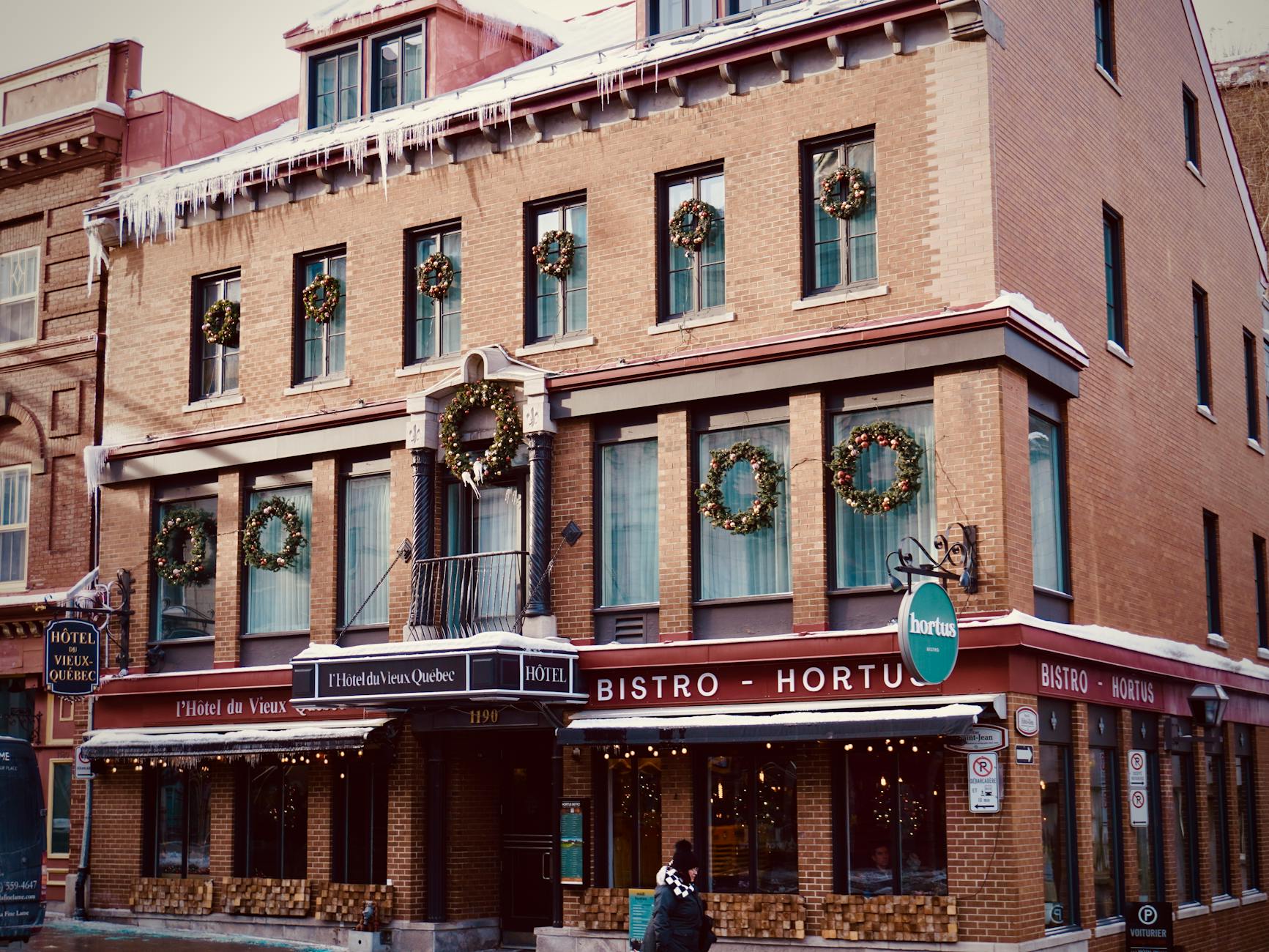 Historic brick hotel in Quebec City with winter decorations