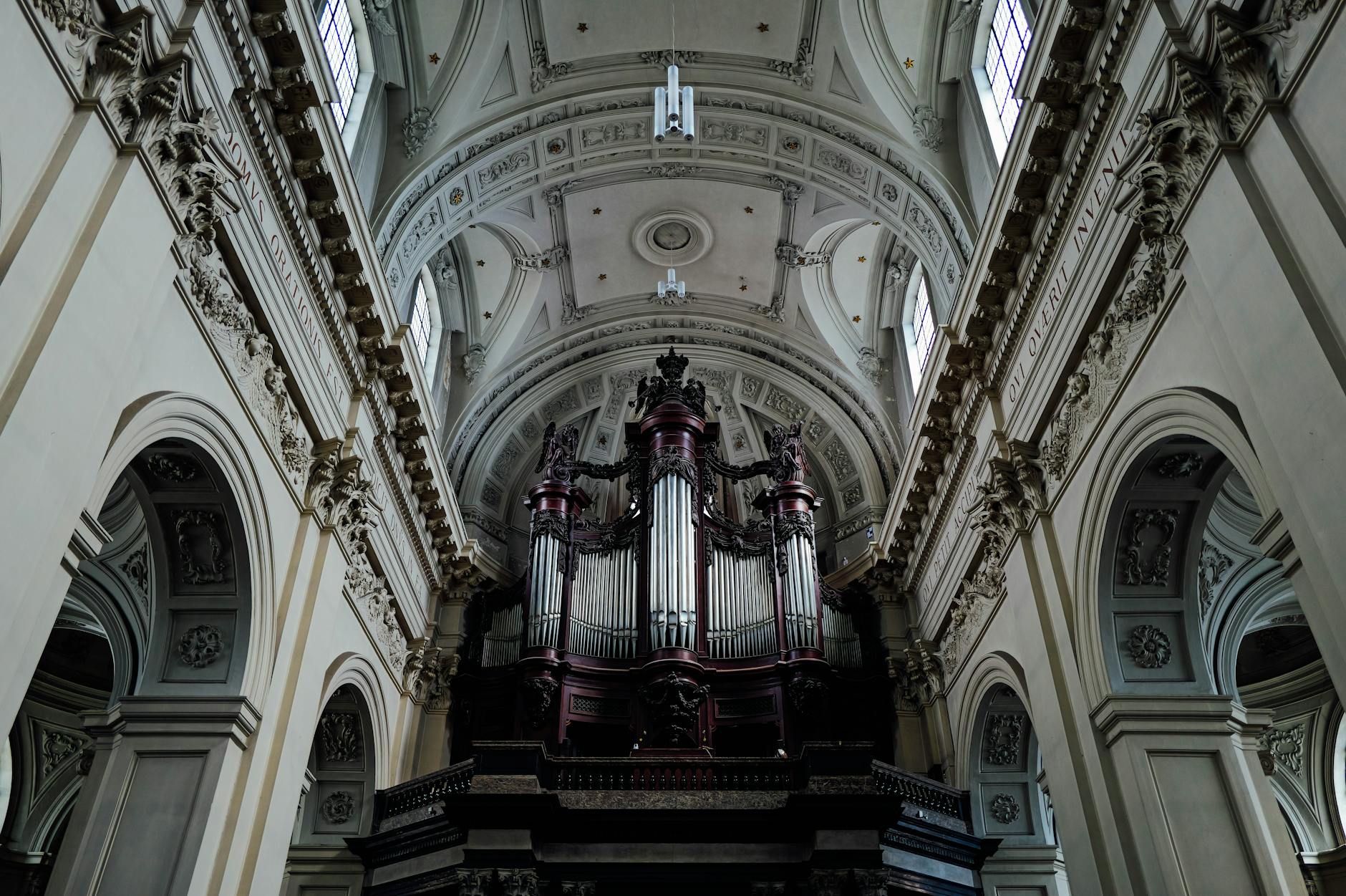 Church interior with ornate organ and architectural details