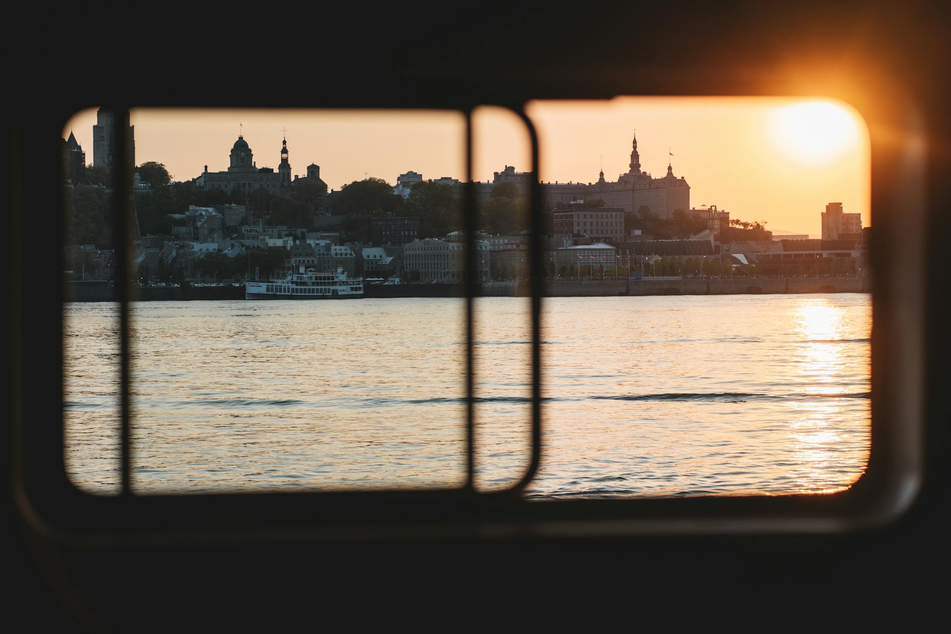 Sunset view of Levis from a boat window