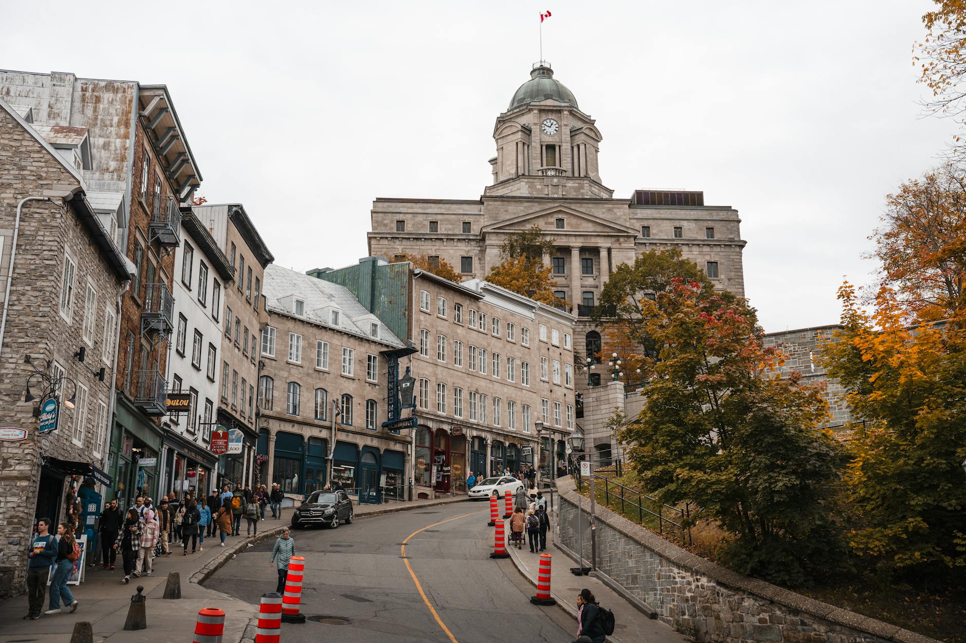 Historic street scene in Old Quebec City under a cloudy sky