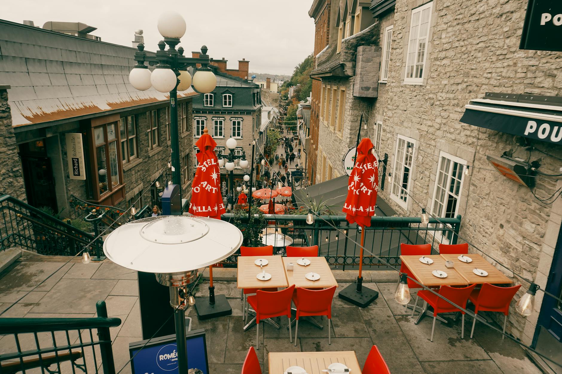 Outdoor cafe in Old Quebec overlooking a historic street