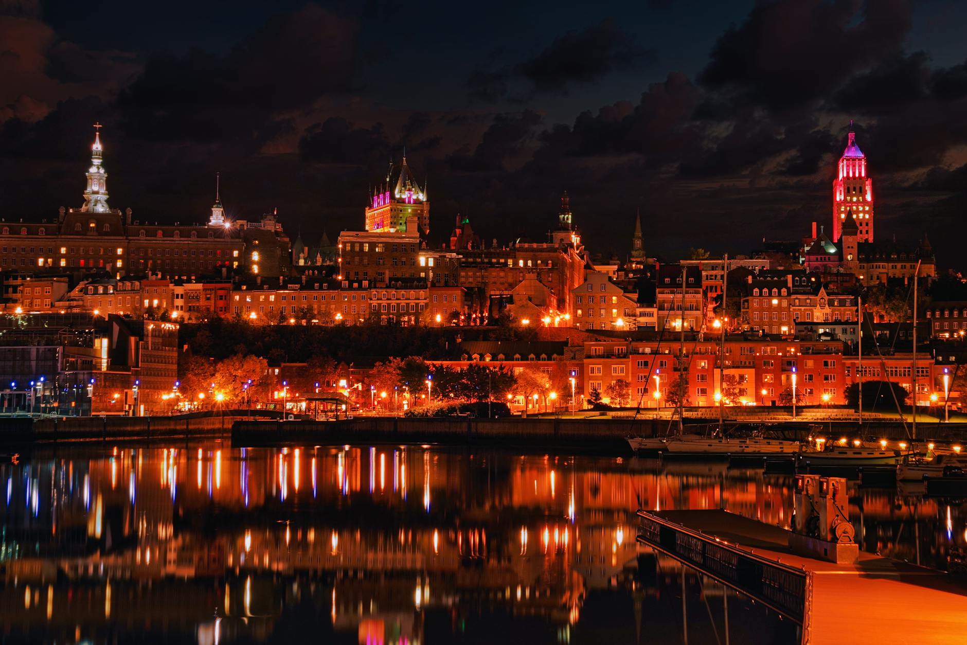 Night view of Quebec City reflected on the water