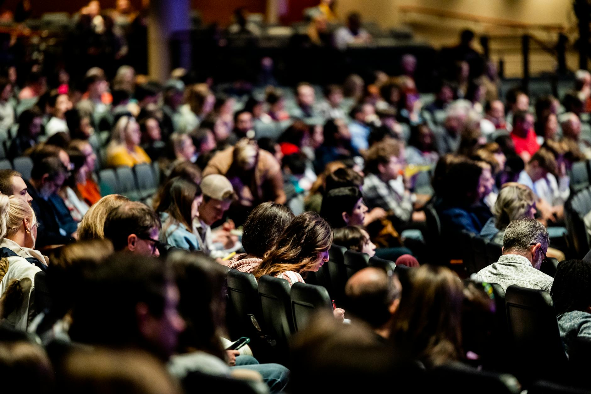 Audience seated in an indoor event