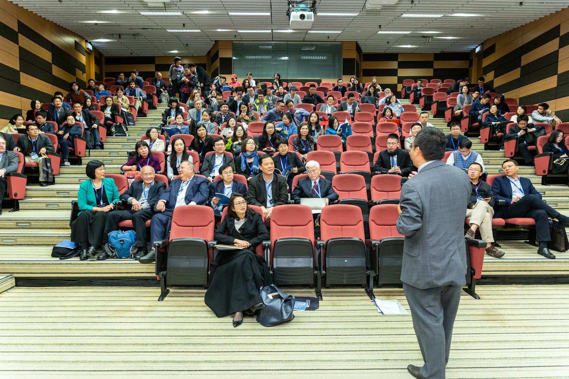 Business conference with attendees and a presenter