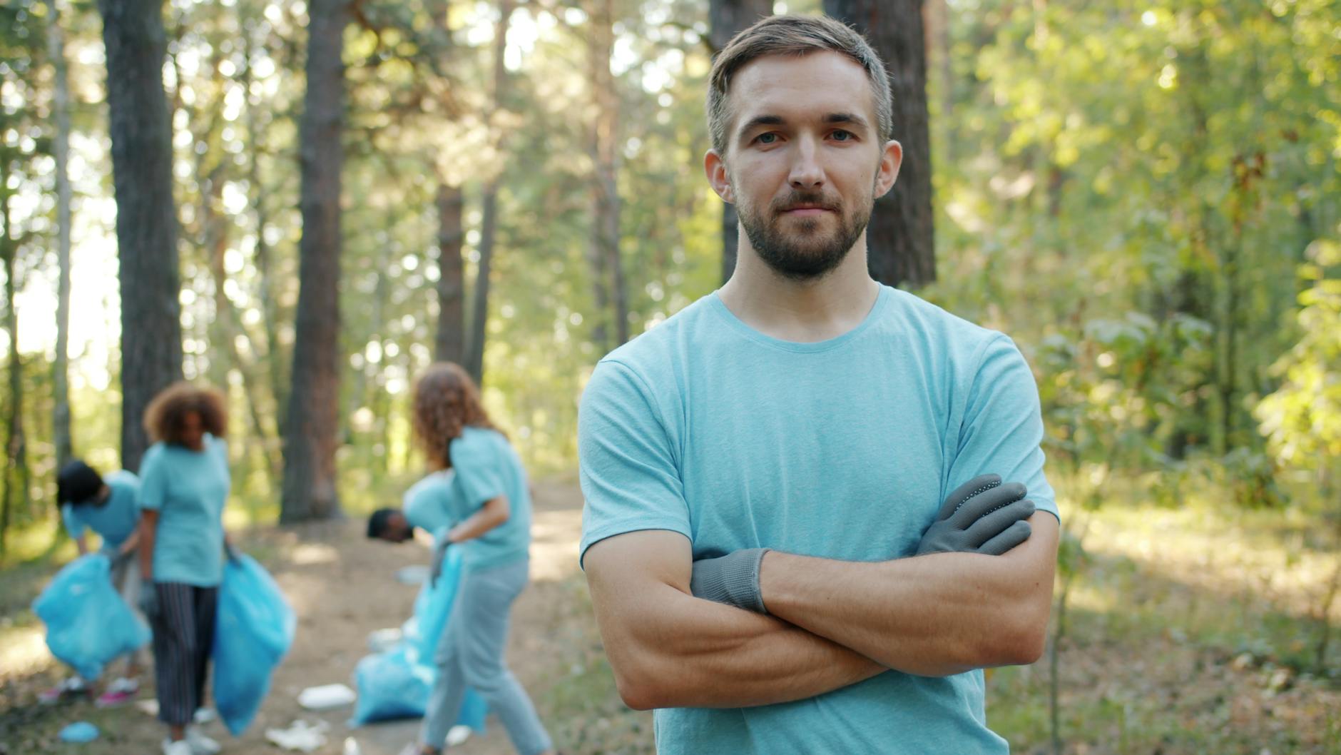 Group of volunteers cleaning a forest area