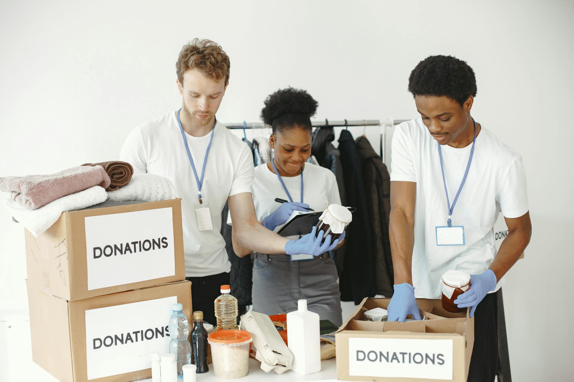 Volunteers organizing donation boxes in a community center