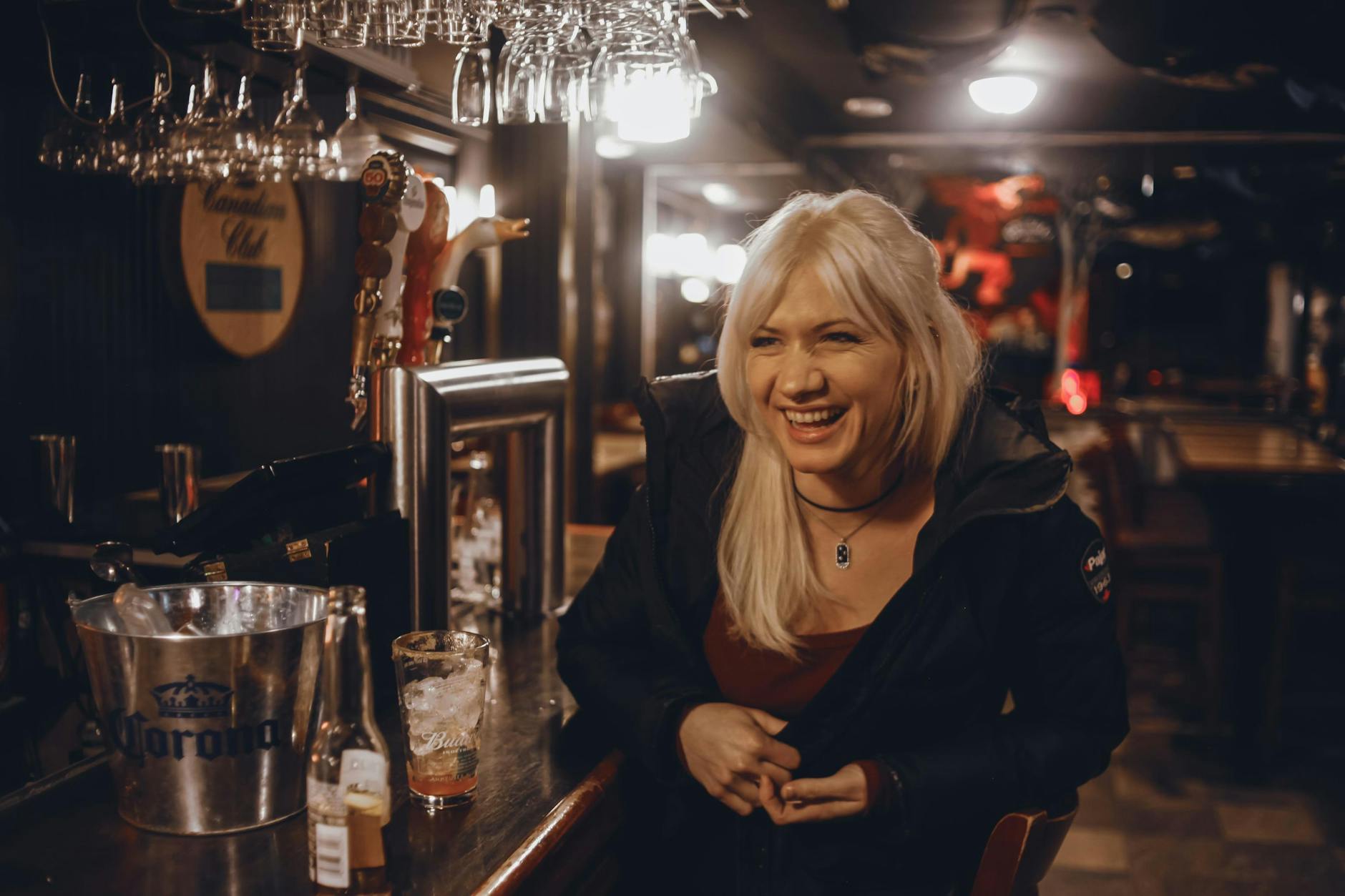Woman enjoying a night out at a bar in Quebec