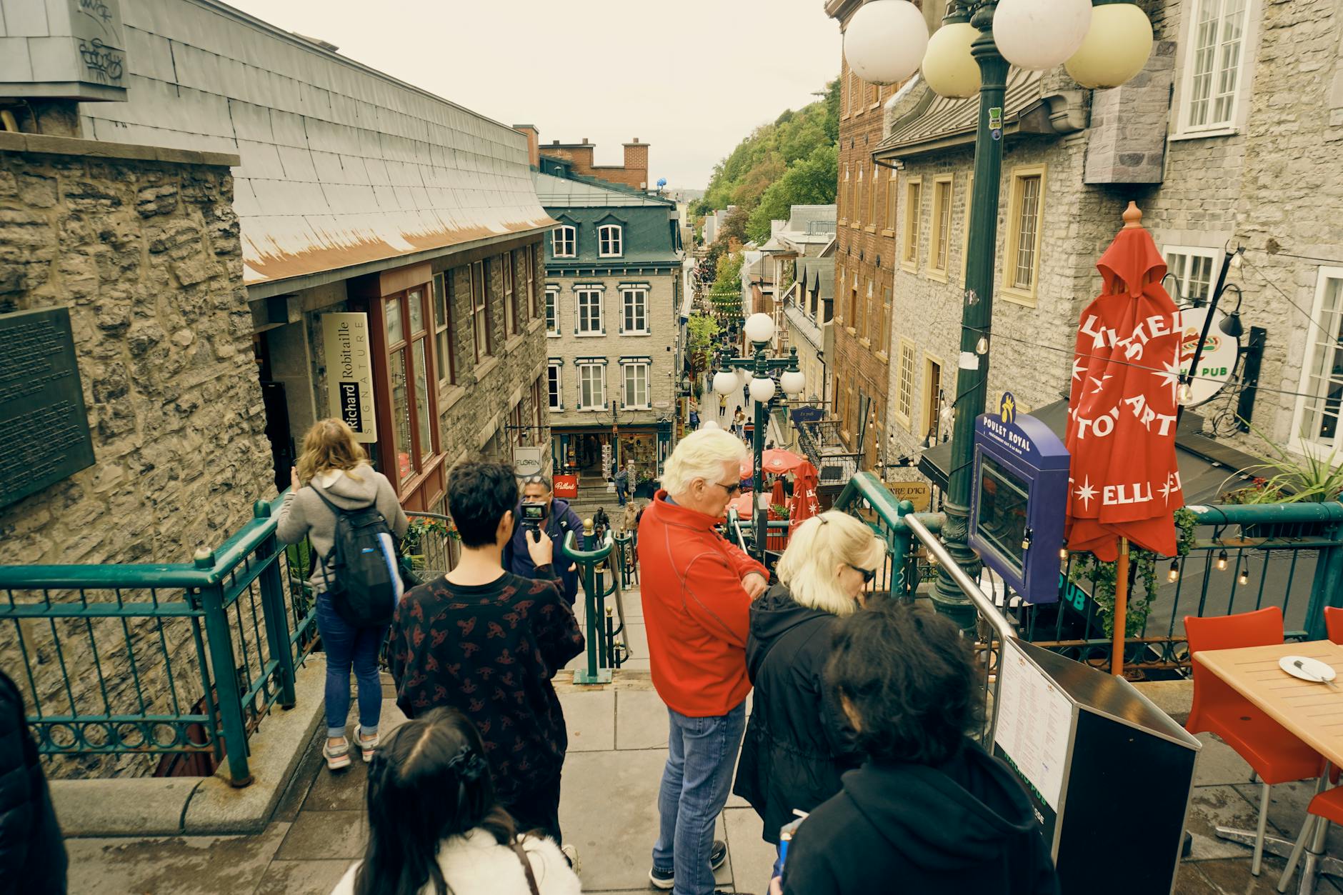 Tourists walking on a historic street in Old Quebec City