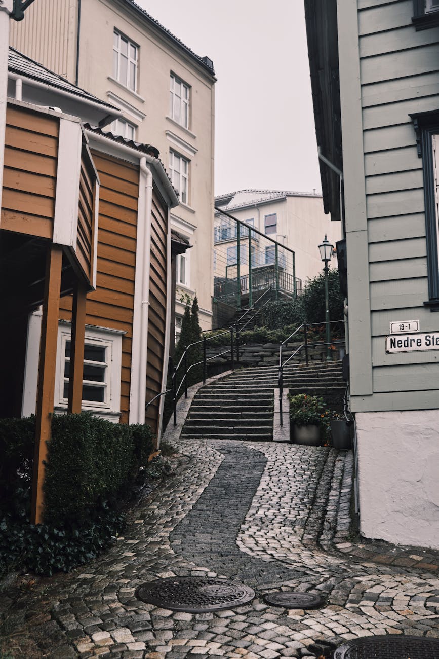 Historic Stavanger cobblestone street for conference travel report planning.