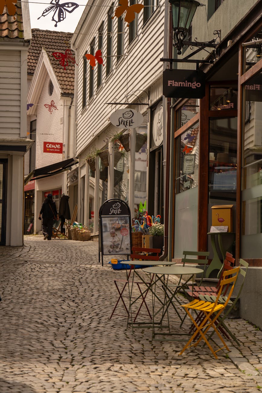 Stavanger cobblestone street with seating for conference arrival planning.