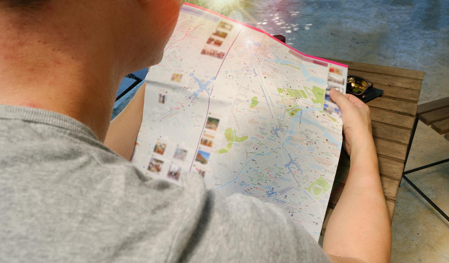 Traveler reading a map for Stavanger budget trip planning.