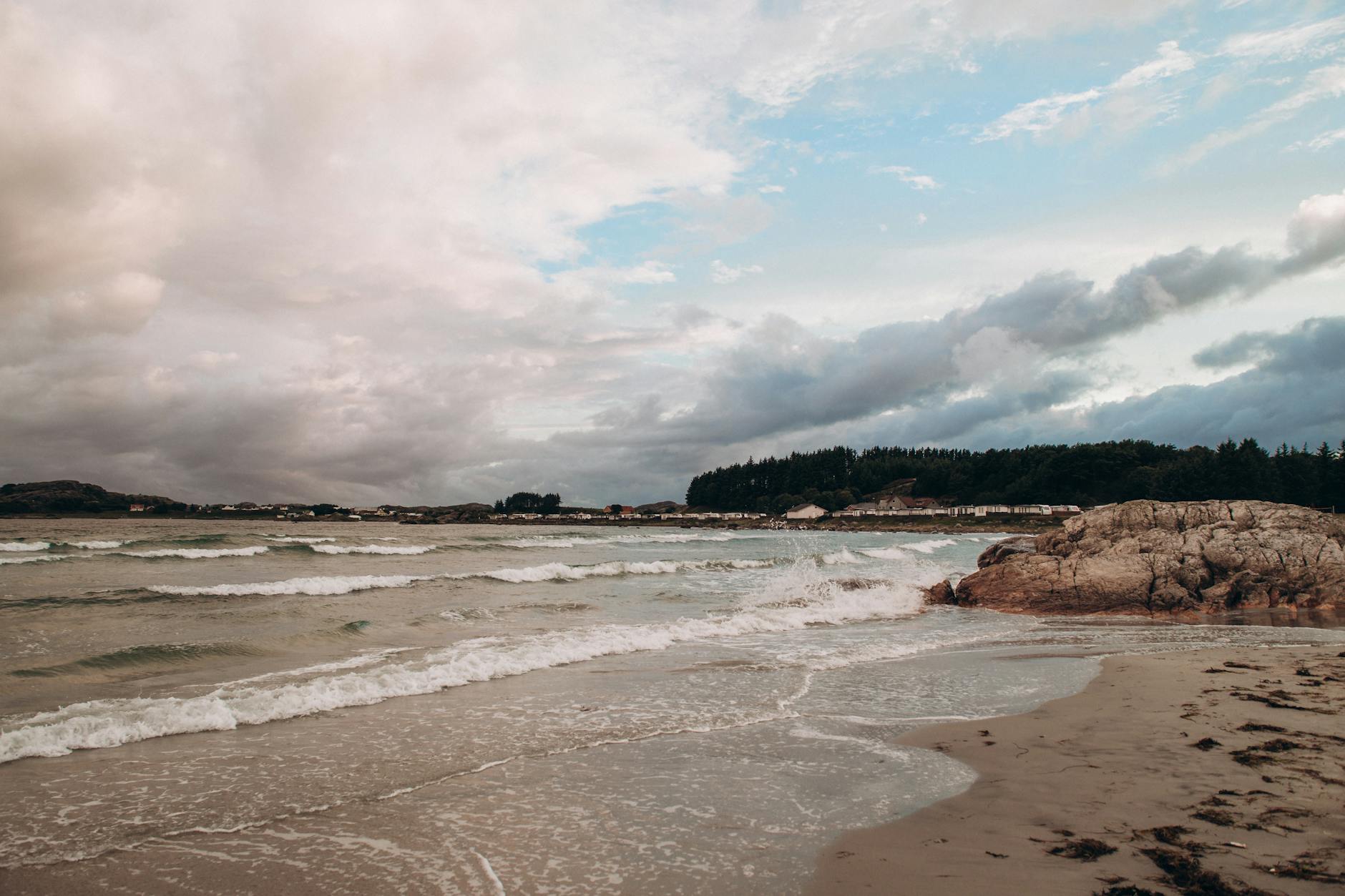 Norwegian beach with cloudy sky for Stavanger budget free-outing planning.