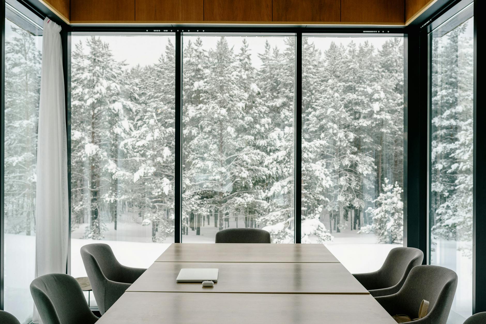 Conference room with snowy view for Stavanger hotel work planning.