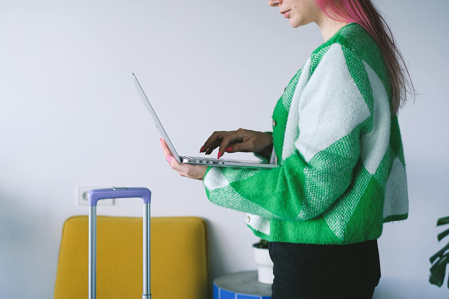 Consultant working near luggage in a hotel lounge for Stavanger work-base planning.