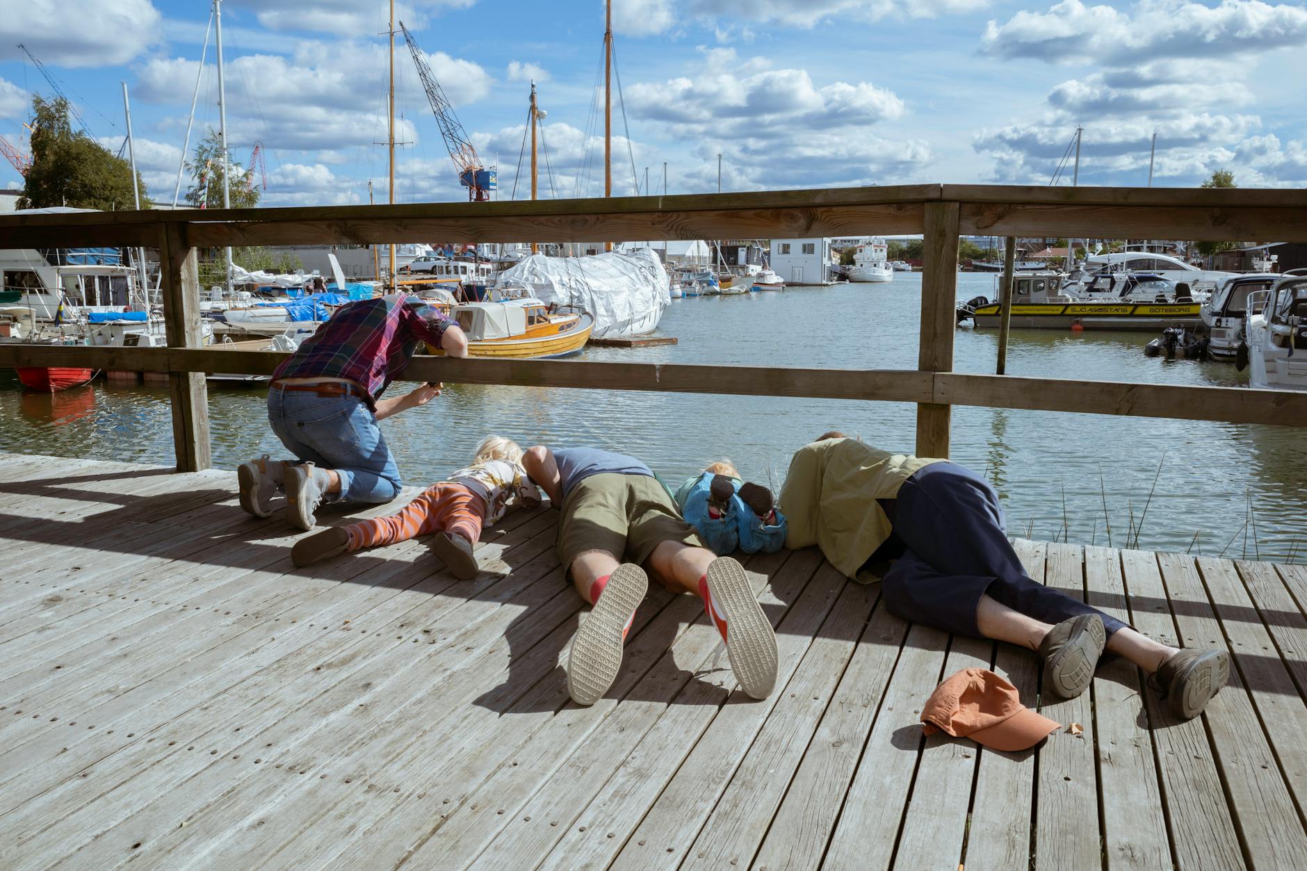 Family by a harbor boardwalk for Stavanger family travel planning.