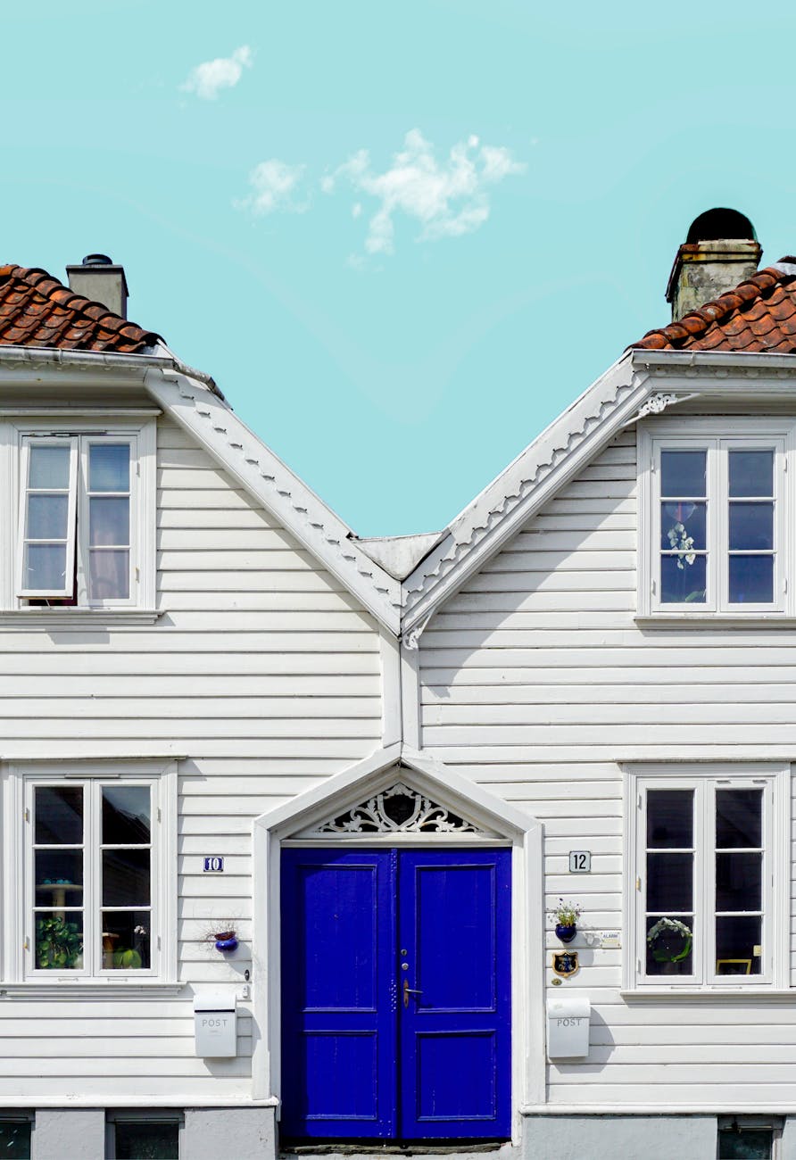 White wooden houses in Stavanger for first-time hotel planning.