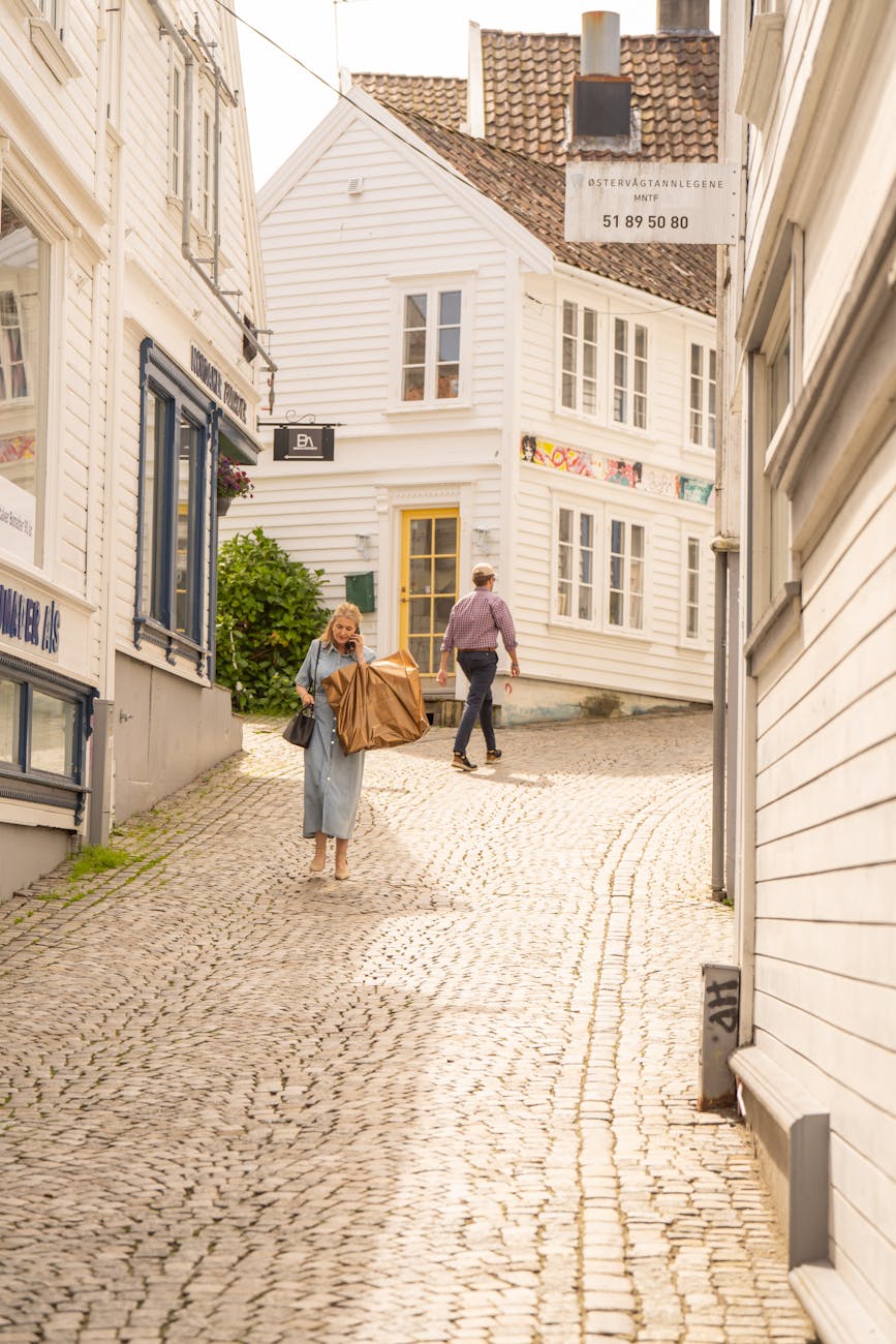White wooden houses in Old Stavanger for weather-aware first visits.